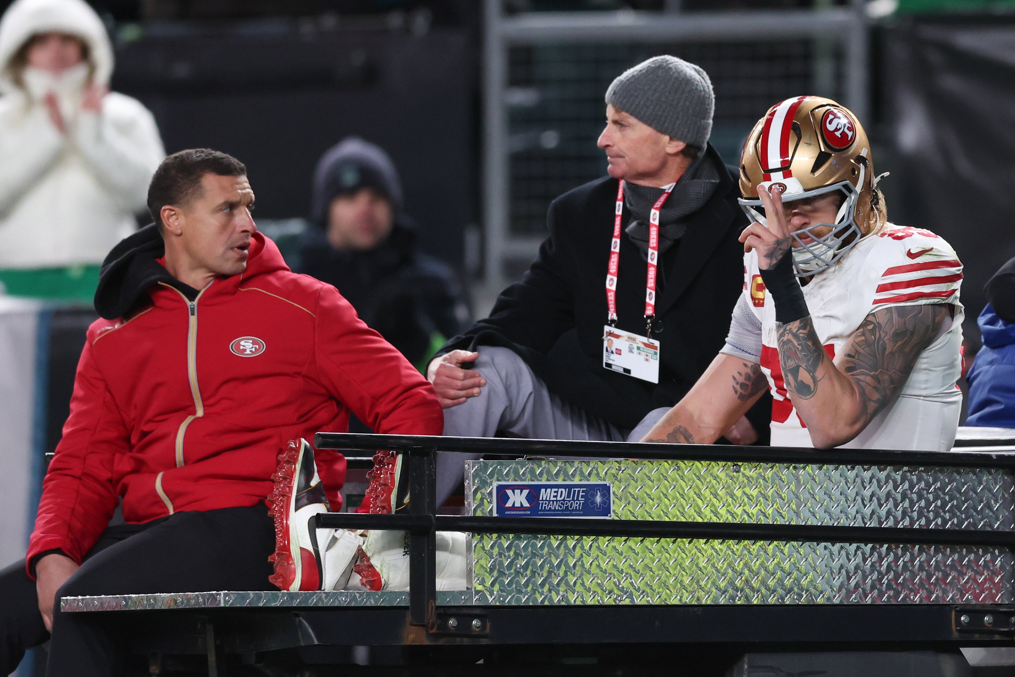 Jan 11, 2026; Philadelphia, PA, USA; San Francisco 49ers tight end George Kittle (85) gestures as he is carted off the field after an injury during the second quarter against the Philadelphia Eagles in an NFC Wild Card Round game at Lincoln Financial Field.