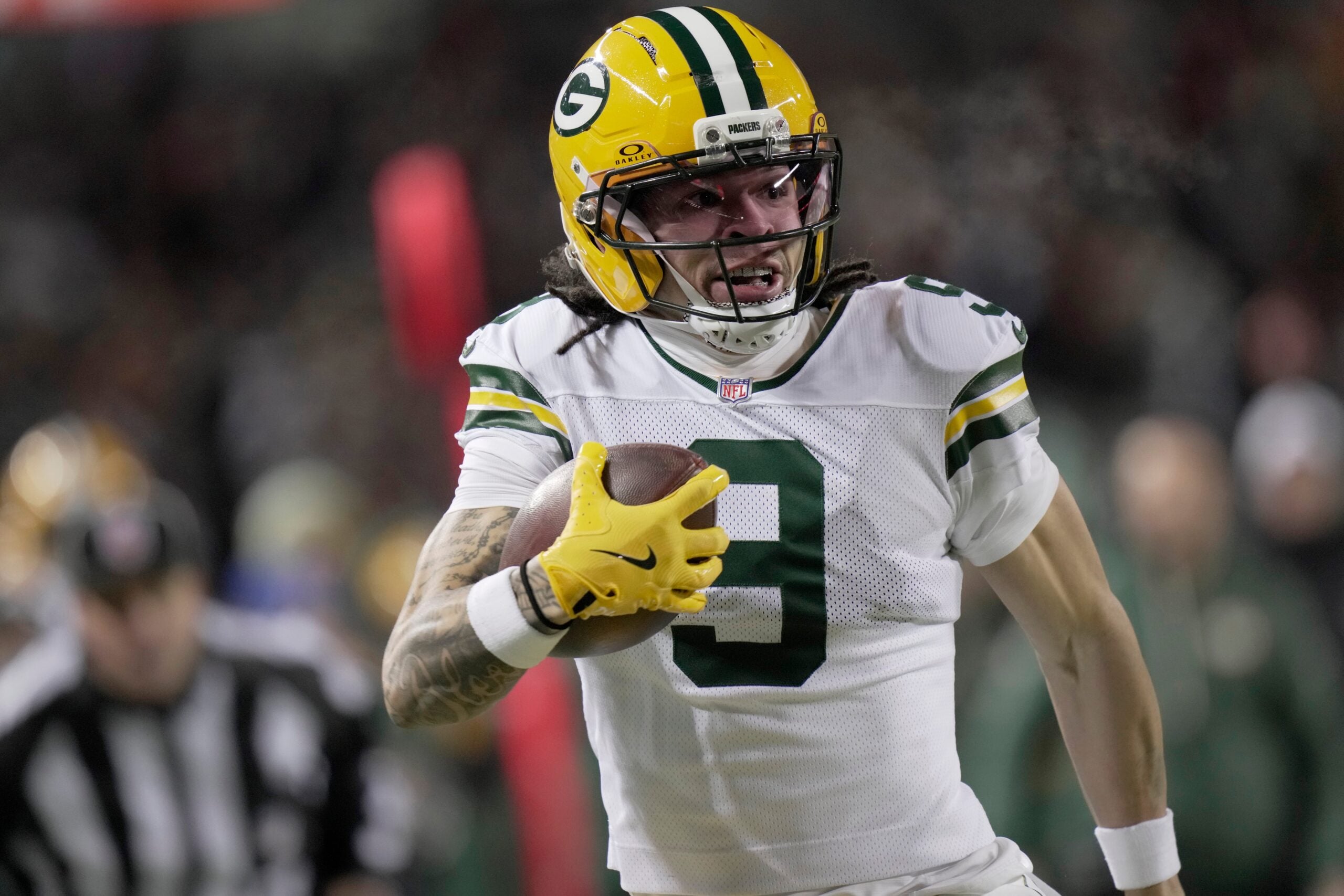 Green Bay Packers wide receiver Christian Watson (9) makes a catch for a first down during the second quarter of their wild card playoff game against the Chicago Bears Saturday, January 10, 2026 at Soldier Field in Chicago, Illinois.