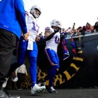 Buffalo Bills quarterback Josh Allen (17) and wide receiver Keon Coleman (0) run on the field before an NFL football AFC Wild Card playoff matchup, Sunday, Jan. 11, 2026, in Jacksonville, Fla. The Bills defeated the Jaguars 27-24.