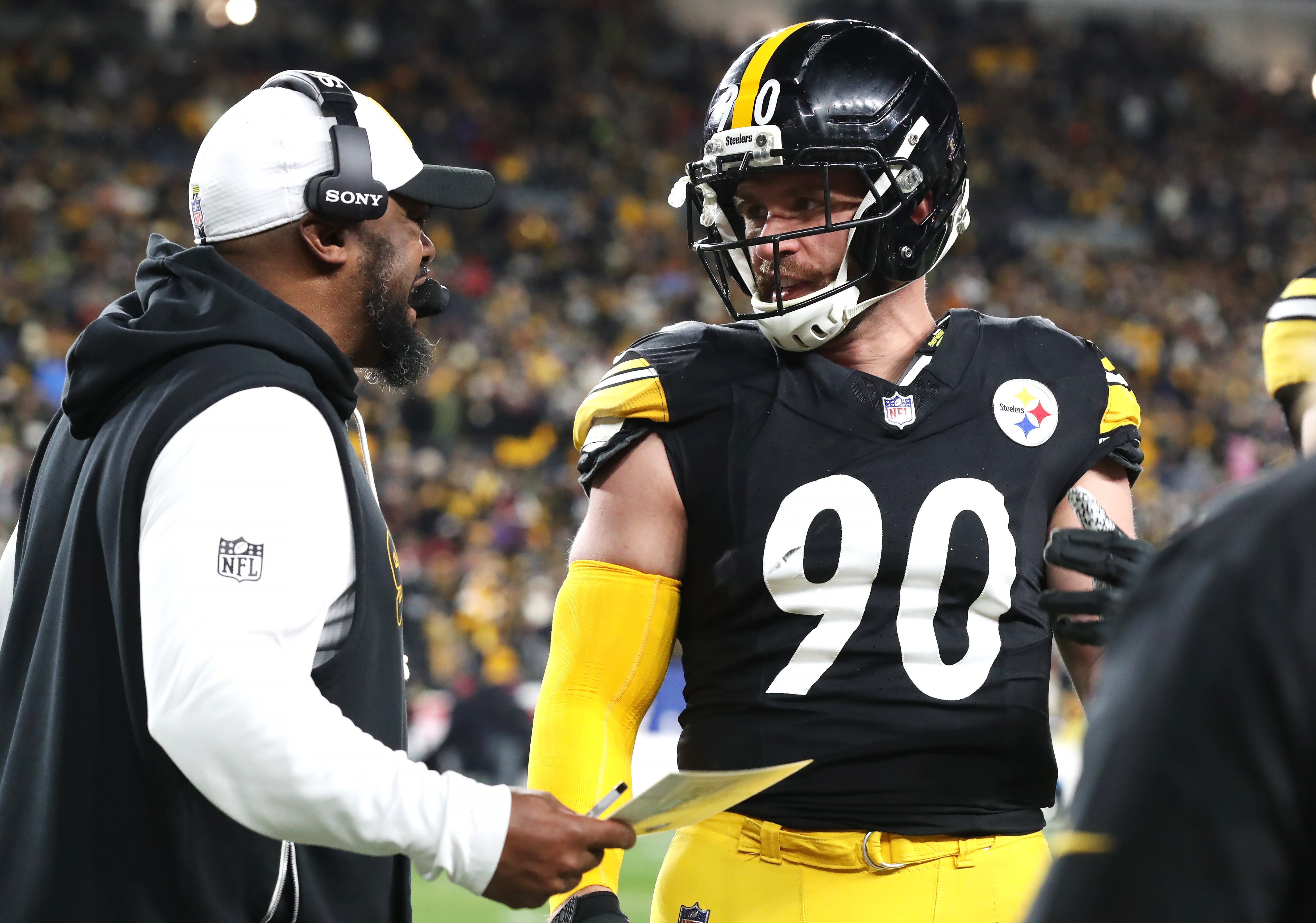 Jan 12, 2026; Pittsburgh, PA, USA; Pittsburgh Steelers head coach Mike Tomlin talks to linebacker T.J. Watt (90) during the first half of an AFC Wild Card Round against the Houston Texans game at Acrisure Stadium.