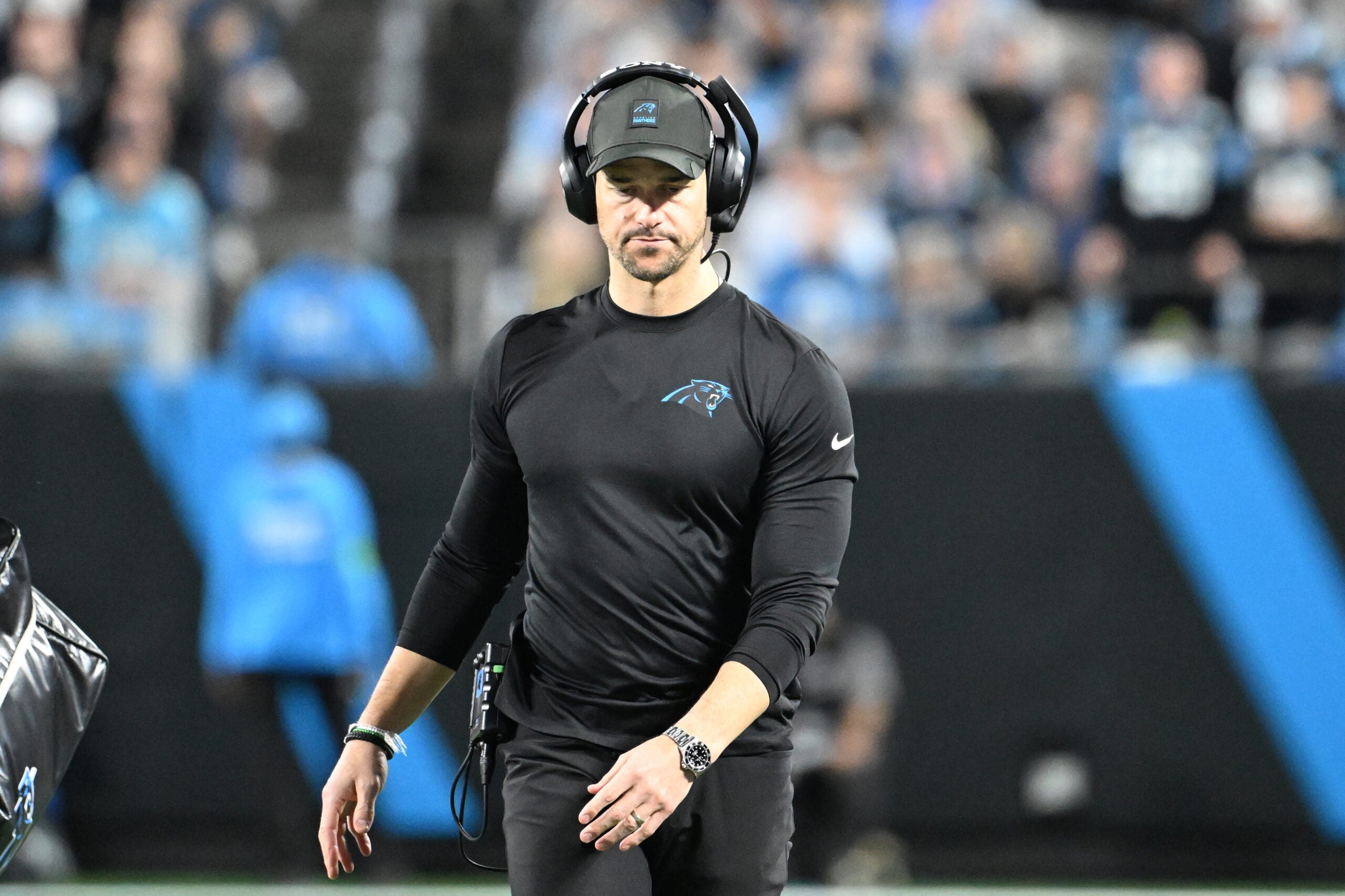 Jan 10, 2026; Charlotte, NC, USA; Carolina Panthers head coach Dave Canales on the field in the second quarter in an NFC Wild Card Round game at Bank of America Stadium.