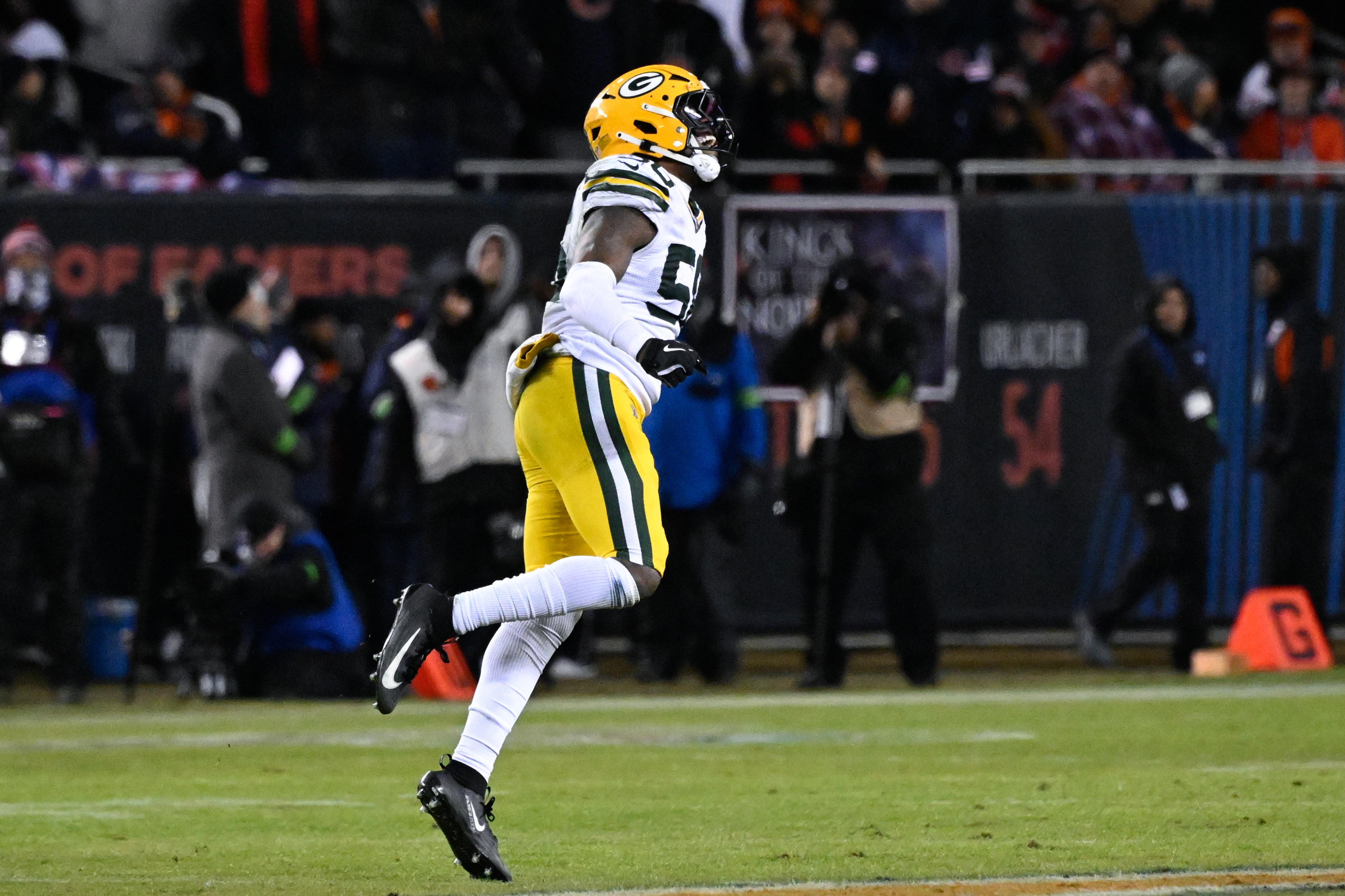 Jan 10, 2026; Chicago, IL, USA; in Green Bay Packers linebacker Edgerrin Cooper (56) reacts after he takes down Chicago Bears running back Kyle Monangai (25) during an NFC Wild Card Round game at Soldier Field.