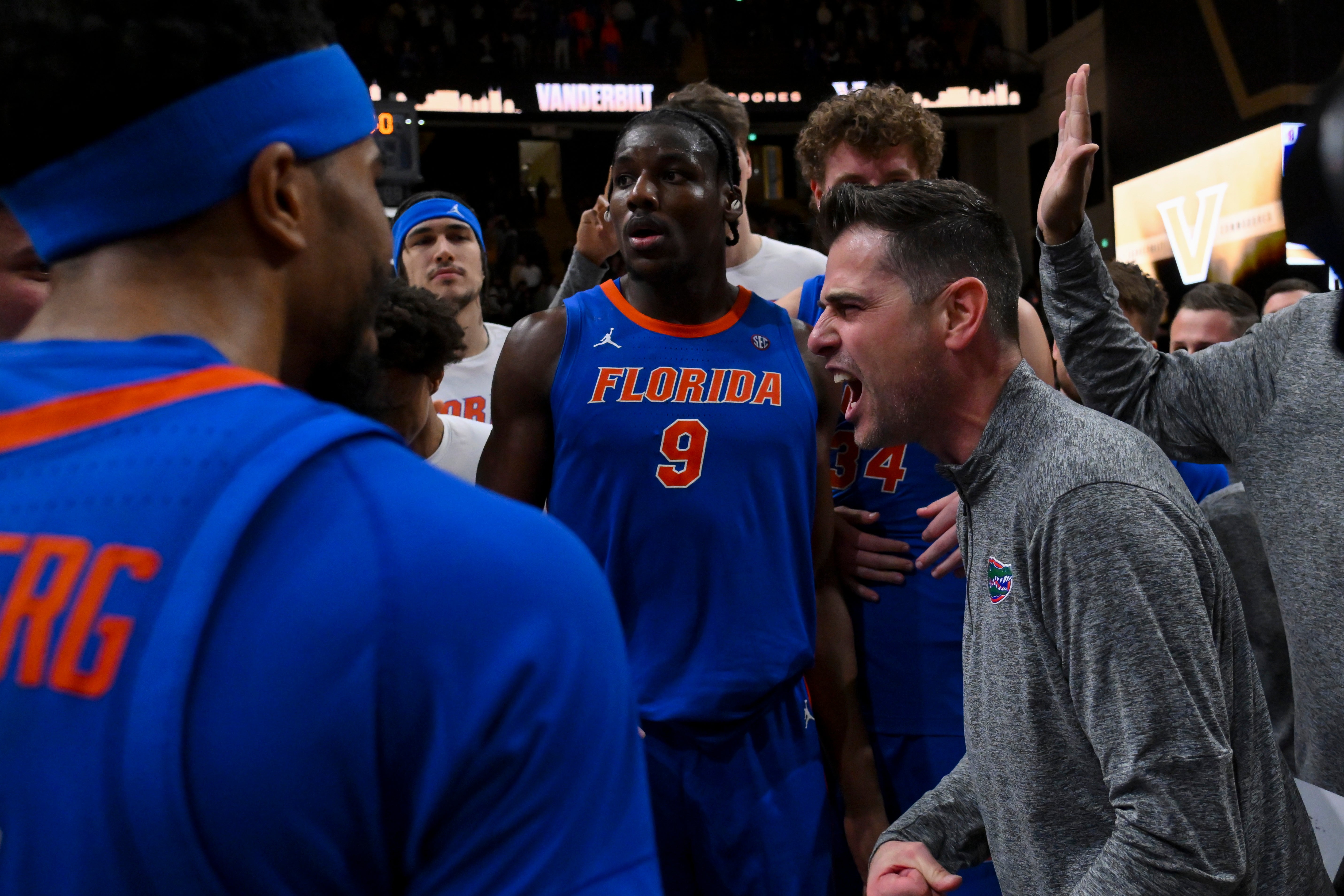 Jan 17, 2026; Nashville, Tennessee, USA; Florida Gators head coach Todd Golden and center Rueben Chinyelu (9) celebrate the win with their team against the Vanderbilt Commodores during the second half at Memorial Gymnasium.
