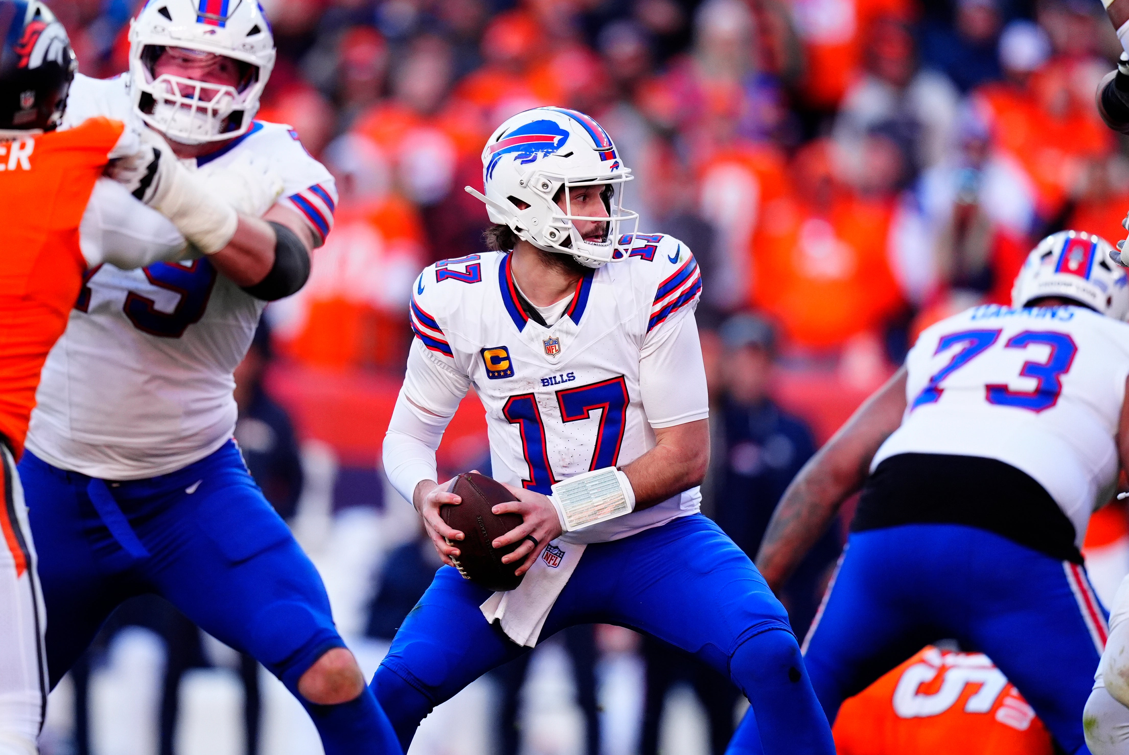 Jan 17, 2026; Denver, CO, USA; Buffalo Bills quarterback Josh Allen (17) looks to throw during the second quarter of an AFC Divisional Round playoff game against the Denver Broncos at Empower Field at Mile High.