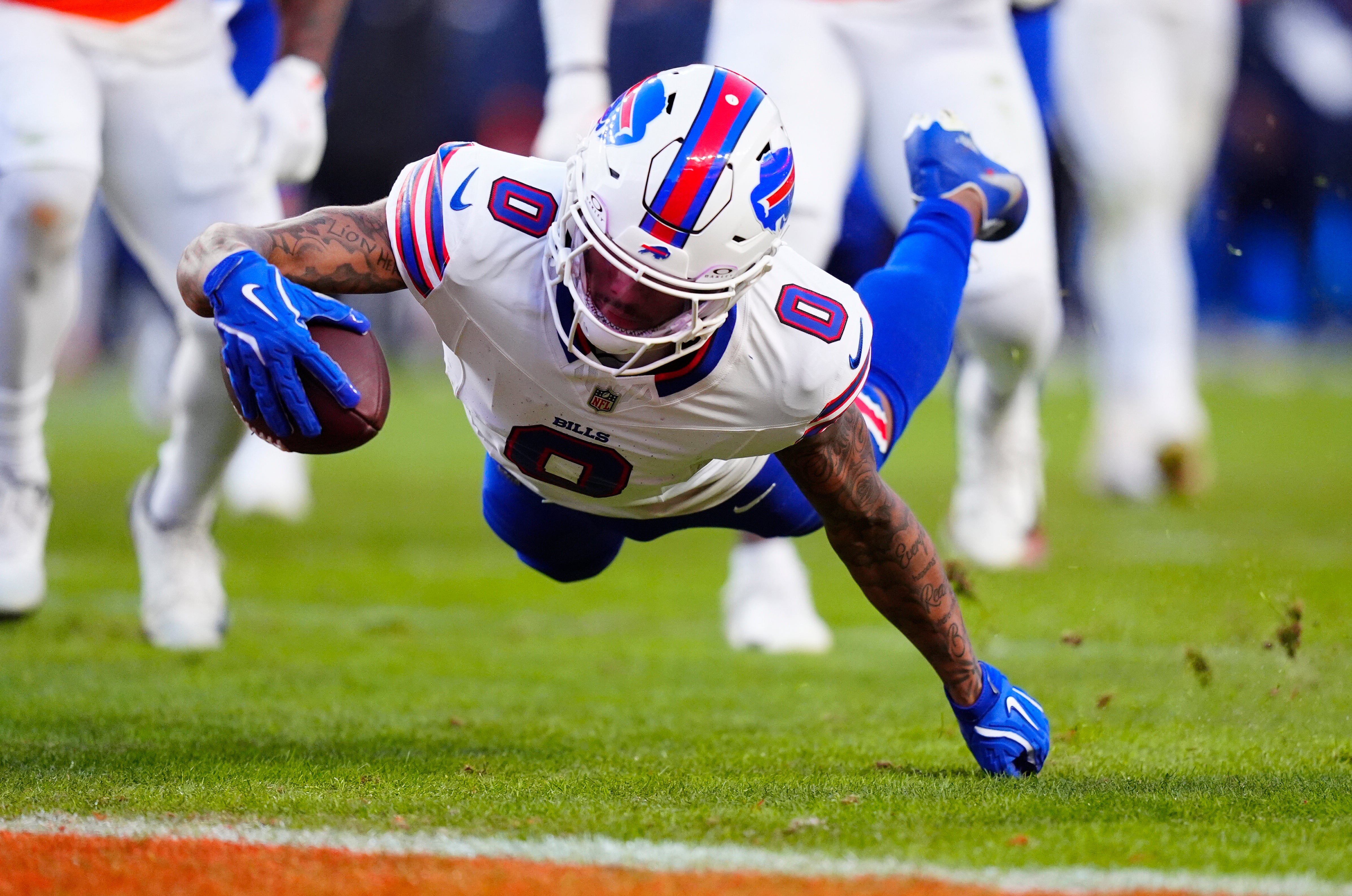 Jan 17, 2026; Denver, CO, USA; Buffalo Bills wide receiver Keon Coleman (0) scores a touchdown during the third quarter of an AFC Divisional Round playoff game against the Denver Broncos at Empower Field at Mile High.