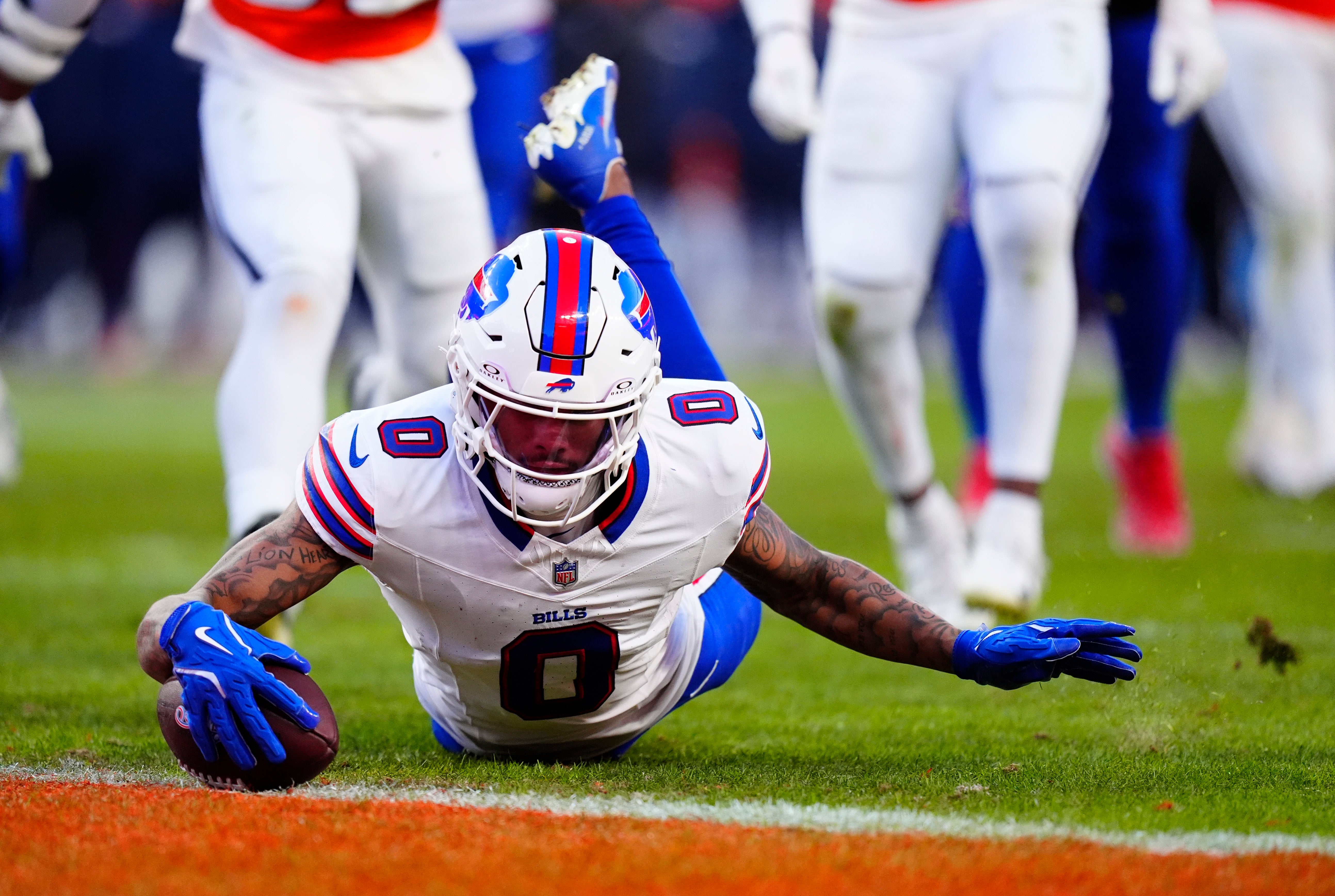 Jan 17, 2026; Denver, CO, USA; Buffalo Bills wide receiver Keon Coleman (0) scores a touchdown during the third quarter of an AFC Divisional Round playoff game against the Denver Broncos at Empower Field at Mile High.