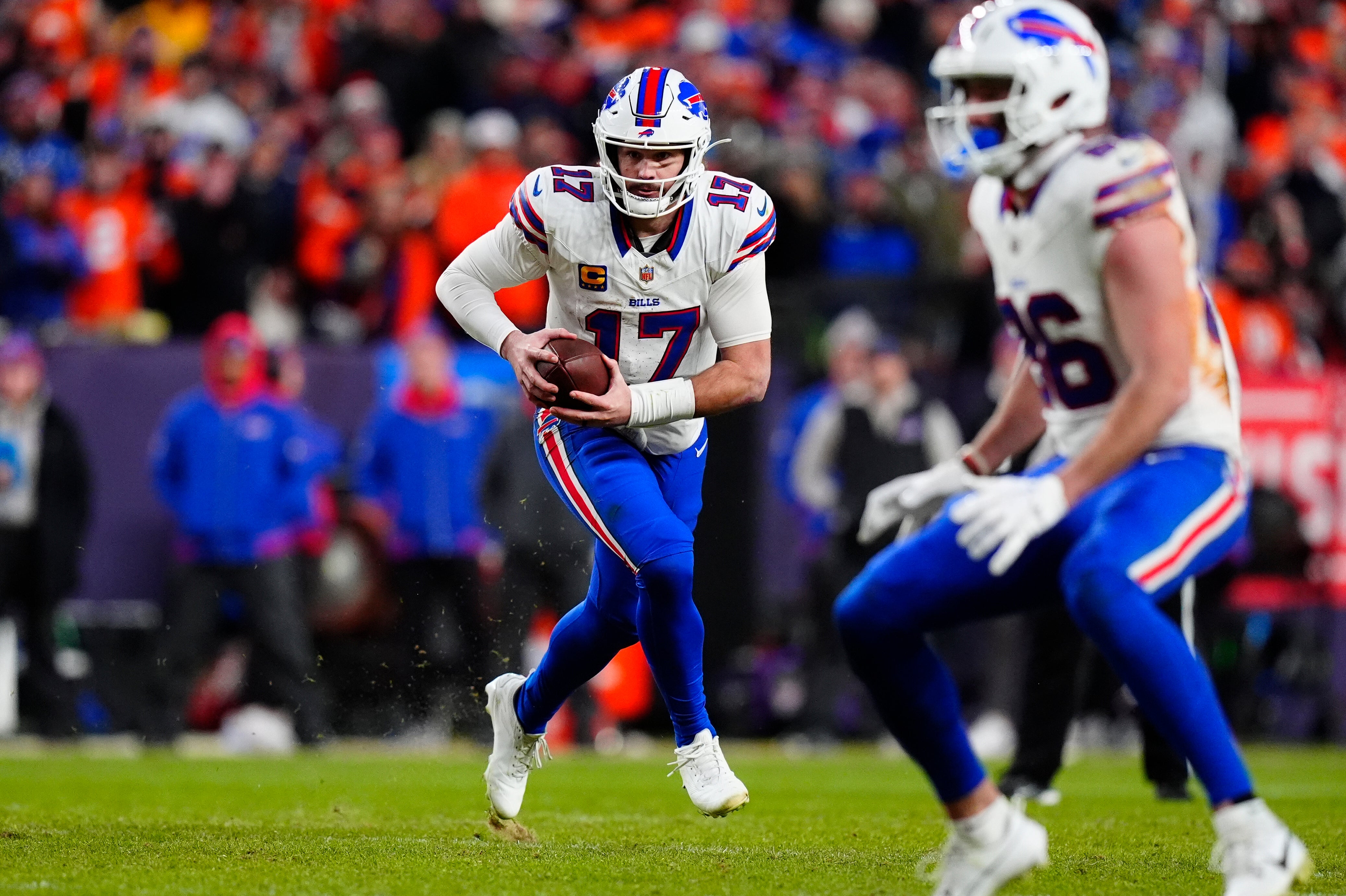 Jan 17, 2026; Denver, CO, USA; Buffalo Bills quarterback Josh Allen (17) runs during the fourth quarter of an AFC Divisional Round playoff game against the Denver Broncos at Empower Field at Mile High.