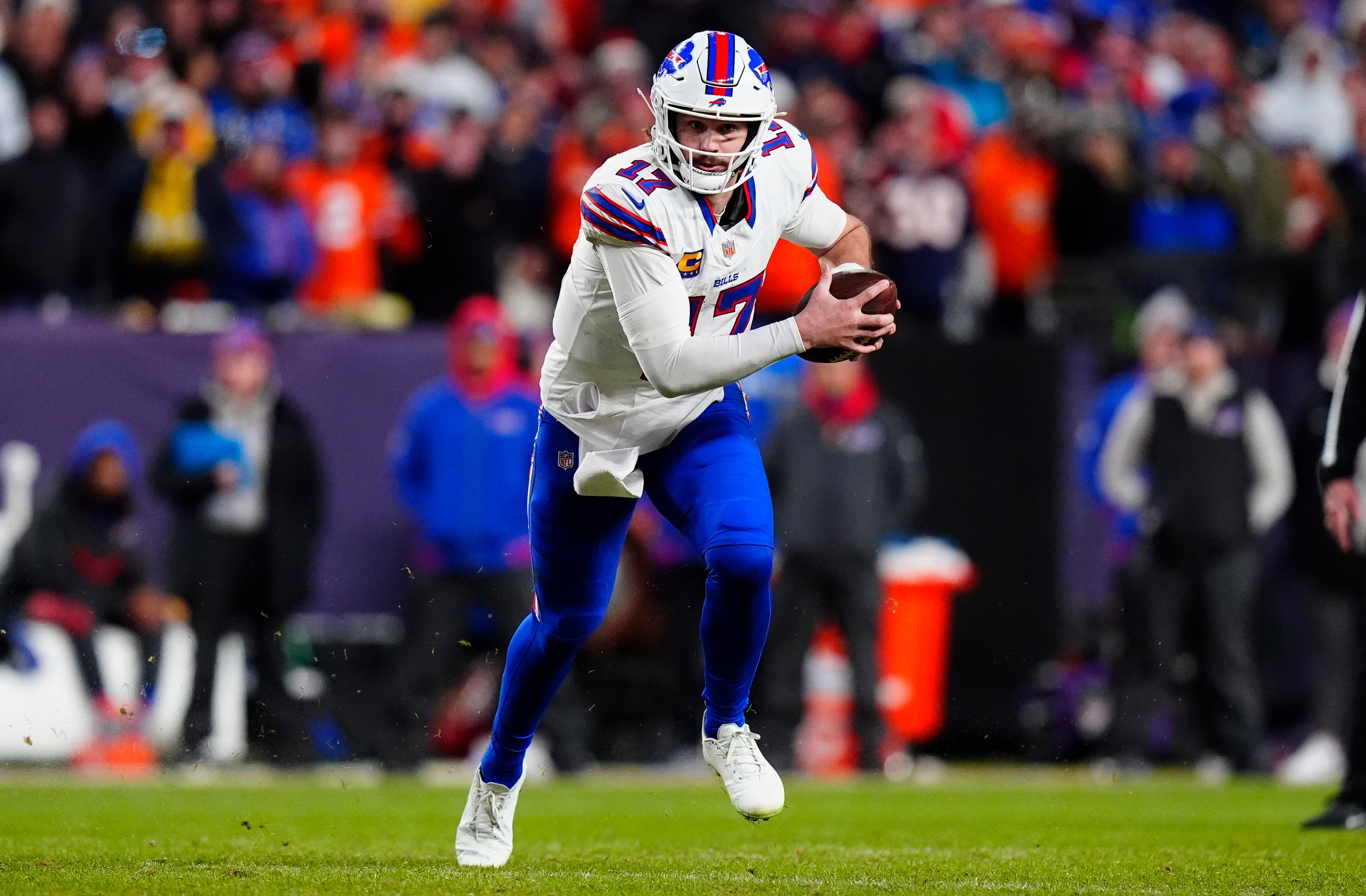 Jan 17, 2026; Denver, CO, USA; Buffalo Bills quarterback Josh Allen (17) runs during the fourth quarter of an AFC Divisional Round playoff game against the Denver Broncos at Empower Field at Mile High.