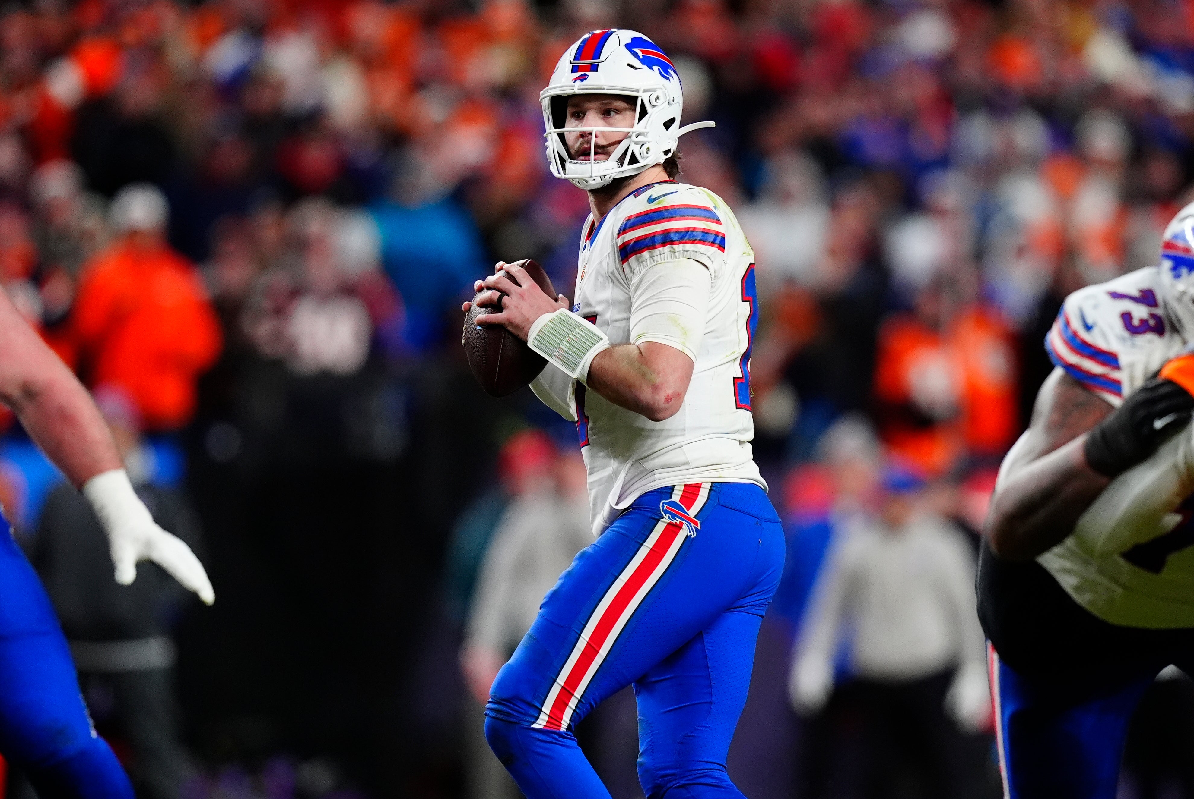 Jan 17, 2026; Denver, CO, USA; Buffalo Bills quarterback Josh Allen (17) drops to throw during the fourth quarter of an AFC Divisional Round playoff game against the Denver Broncos at Empower Field at Mile High.