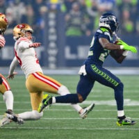 Jan 17, 2026; Seattle, WA, USA; Seattle Seahawks wide receiver Rashid Shaheed (22) returns a kickoff for a touchdown as San Francisco 49ers place kicker Eddy Pineiro (18) attempts to trip him up during the first half in an NFC Divisional Round game at Lumen Field.