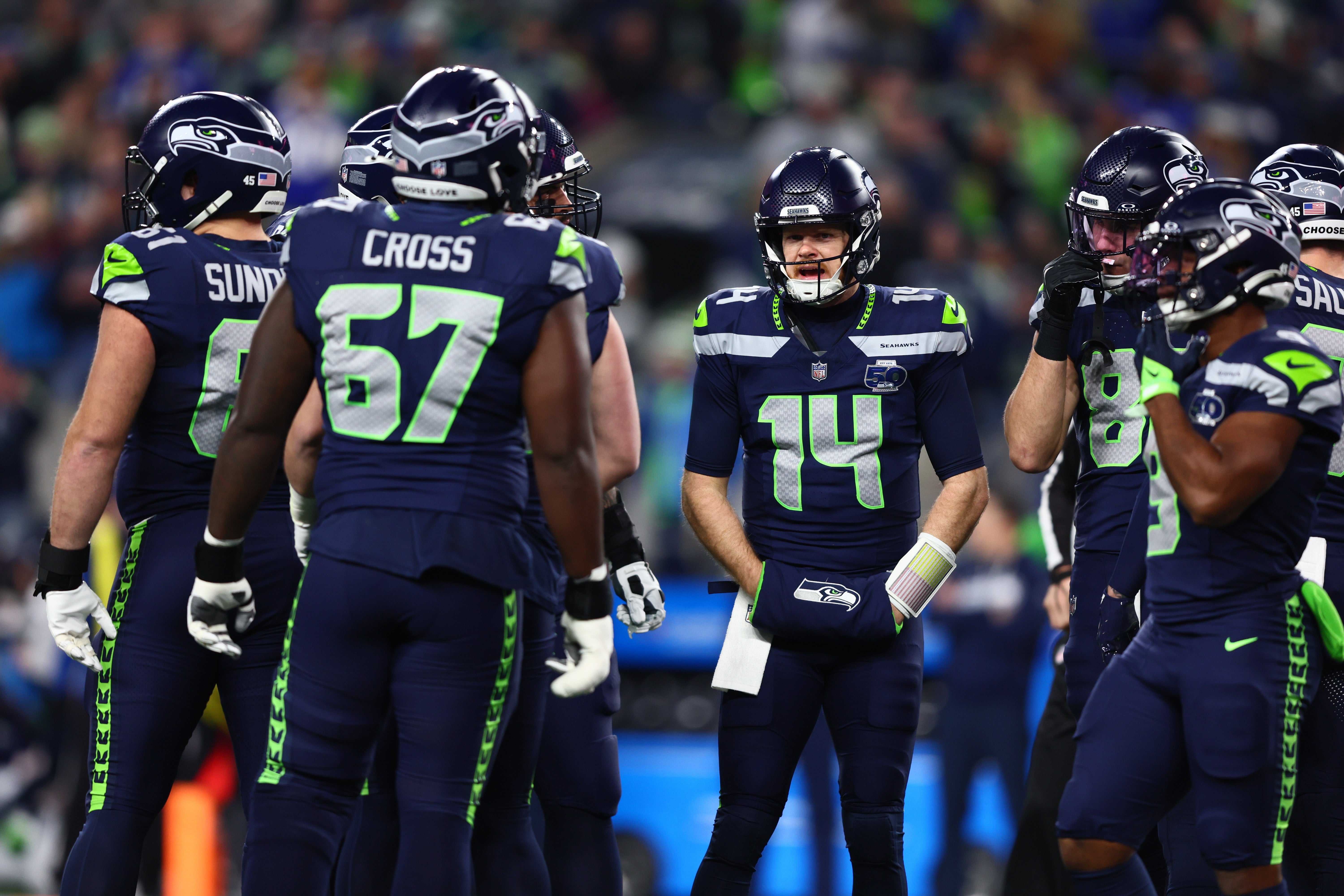 Seahawks offensive huddle during NFC divisional round matchup vs. the 49ers