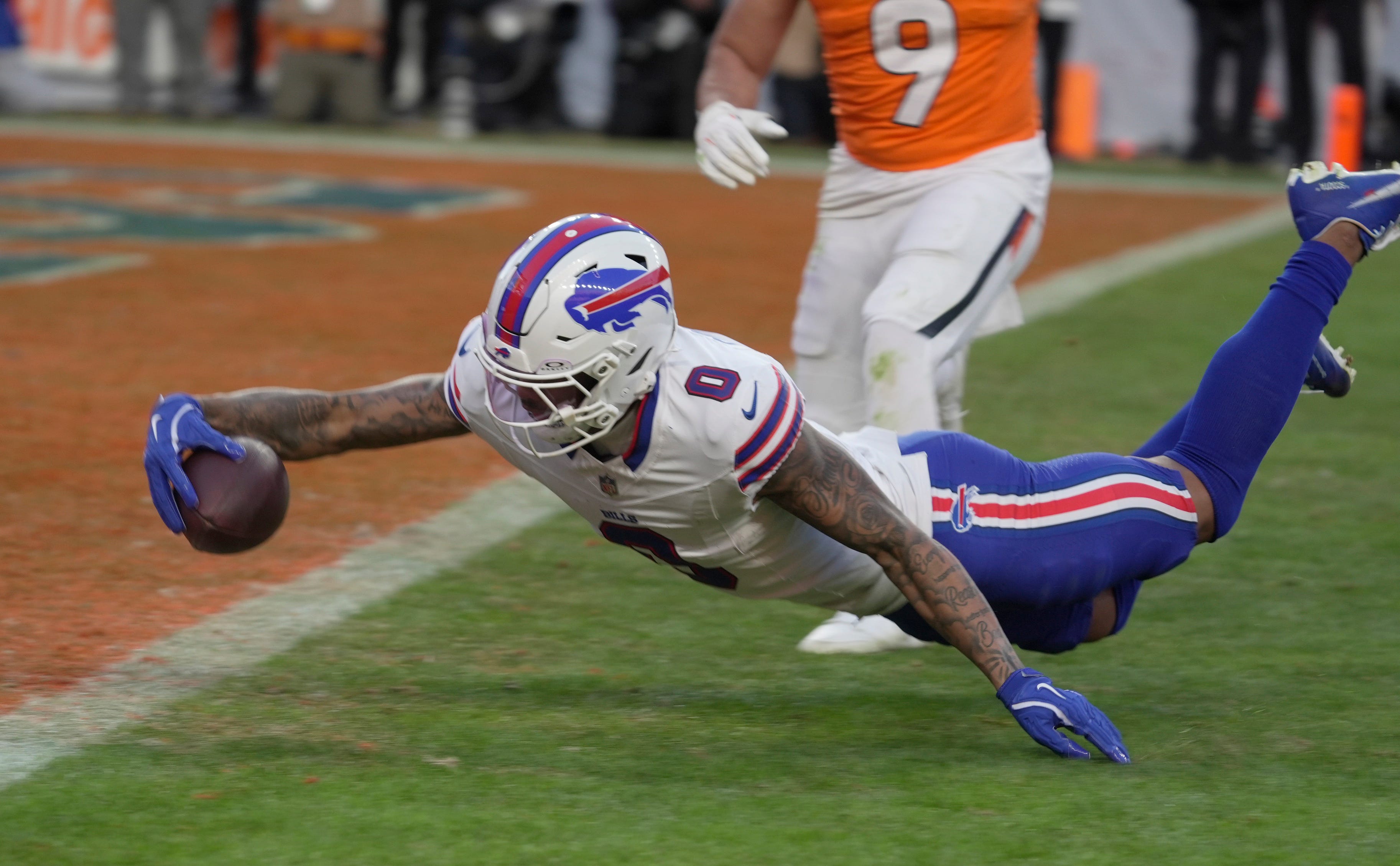Buffalo Bills wide receiver Keon Coleman after getting tripped up stumbles towards the end zone and gets the ball into the end zone before hitting the ground for a touchdown during second half action at Empower FIeld at Mile High in Denver, Colorado on Jan. 17, 2026.