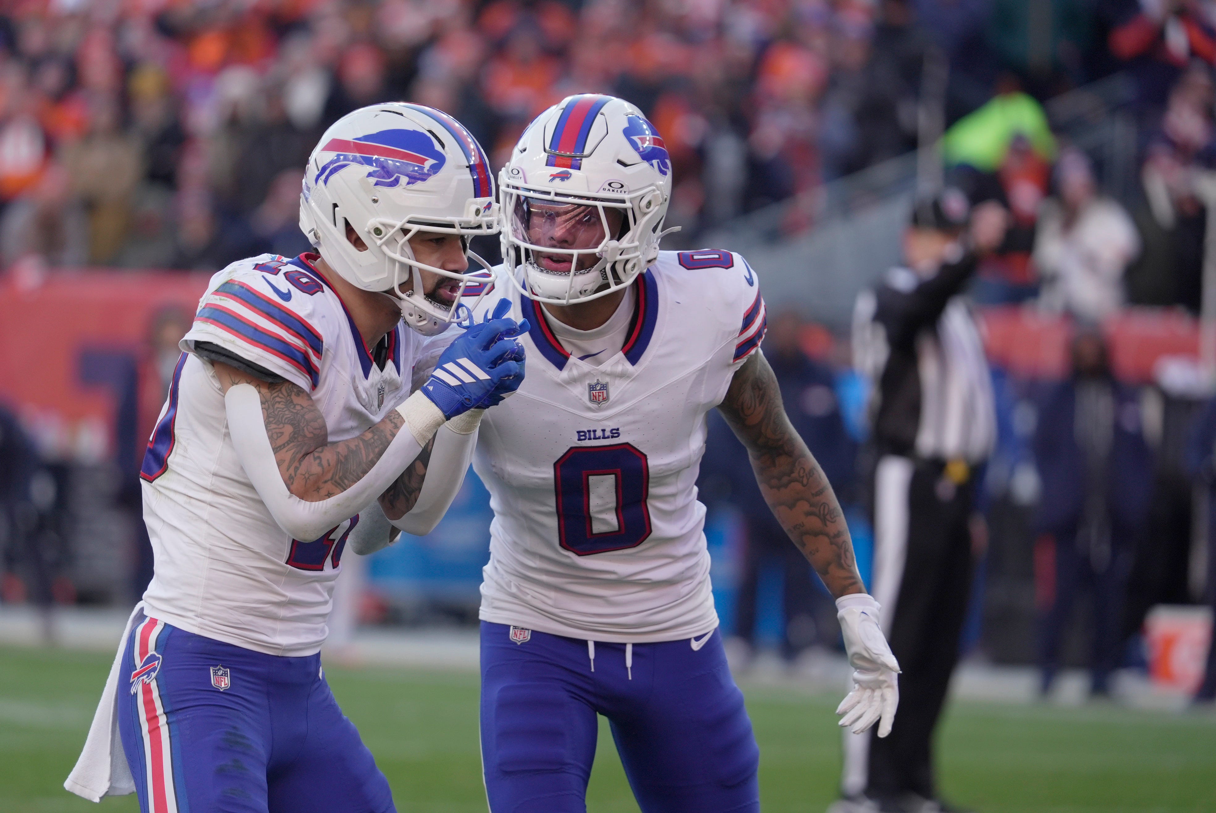Buffalo Bills wide receiver Keon Coleman checks in with wide receiver Khalil Shakir on the play while they line up during first half action at Empower FIeld at Mile High in Denver, Colorado on Jan. 17, 2026.