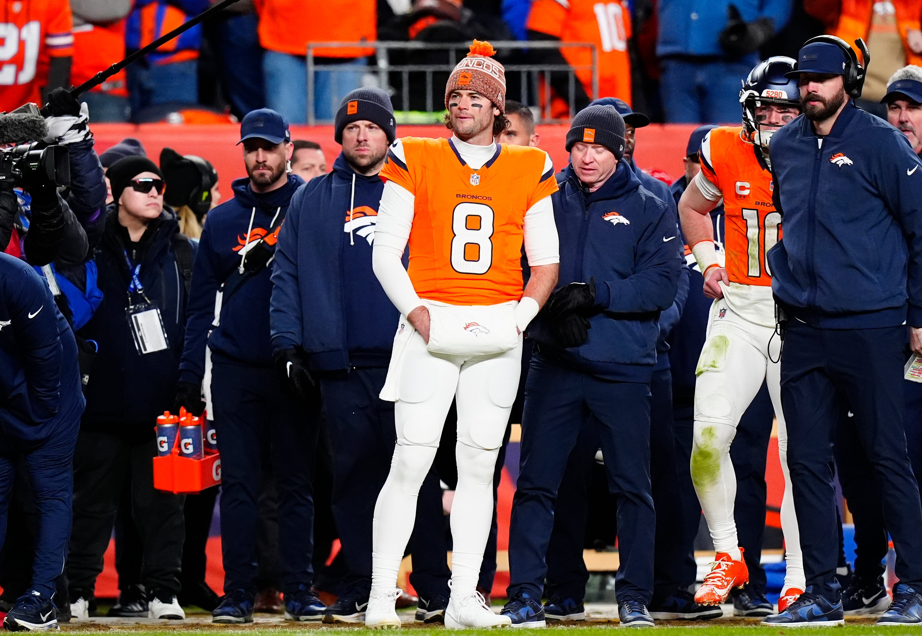 Jan 17, 2026; Denver, CO, USA; Denver Broncos quarterback Jarrett Stidham (8) stands next to quarterback Bo Nix (10)) during overtime of an AFC Divisional Round playoff game against the Buffalo Bills at Empower Field at Mile High.
