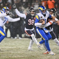 Jan 18, 2026; Chicago, IL, USA; Chicago Bears cornerback Kyler Gordon (6) sacks Los Angeles Rams quarterback Matthew Stafford (9) during the second quarter of an NFC Divisional Round game at Soldier Field.