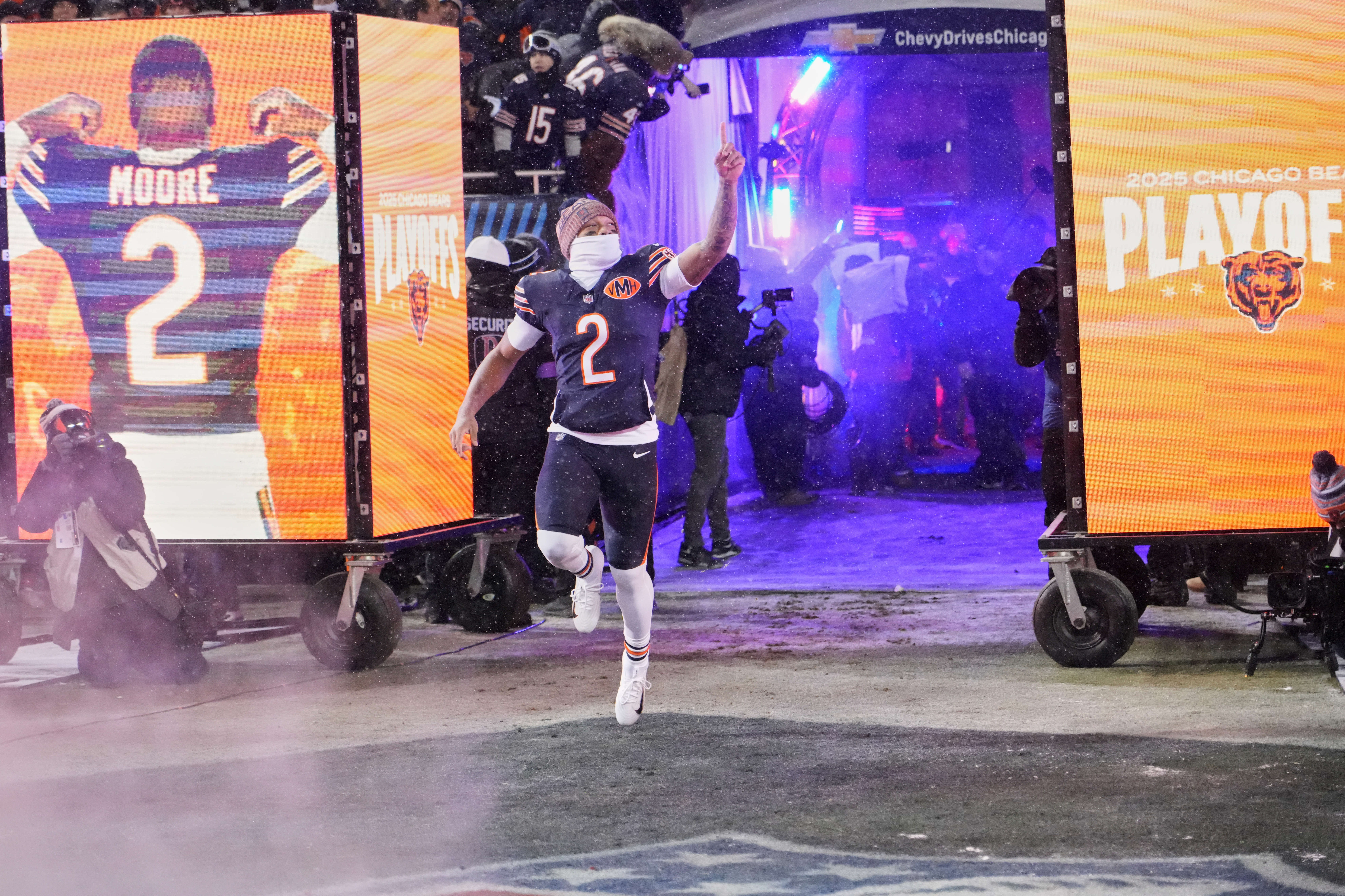 Jan 18, 2026; Chicago, IL, USA; Chicago Bears wide receiver DJ Moore (2) runs onto the field during player introductions before a NFC Divisional Round game against the Los Angeles Rams at Soldier Field.