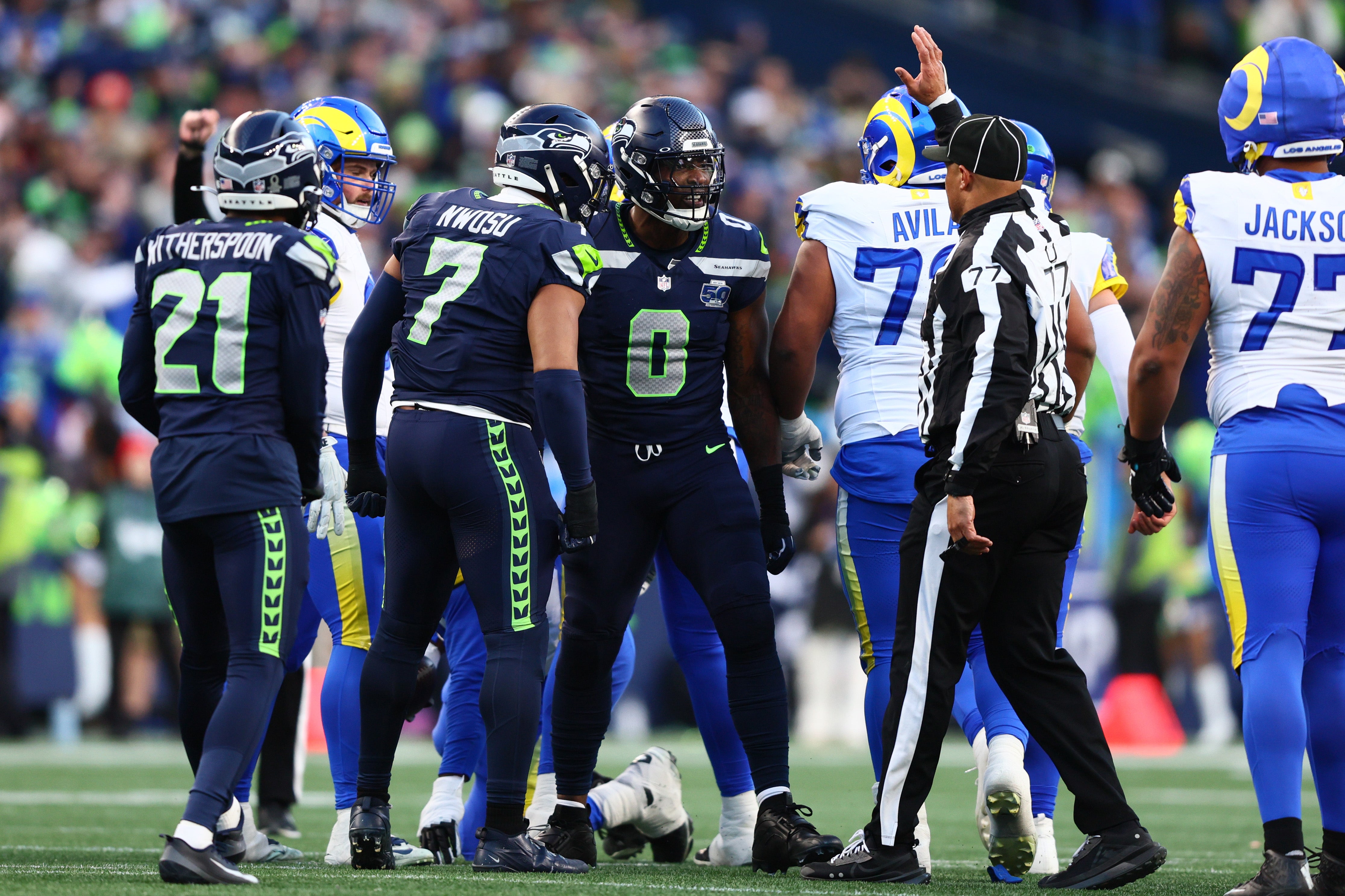 Jan 25, 2026; Seattle, WA, USA; Seattle Seahawks defensive end DeMarcus Lawrence (0) reacts after a play against the Los Angeles Rams during the first half in the 2026 NFC Championship Game at Lumen Field.