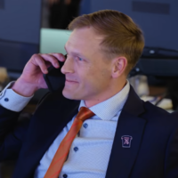 Chicago Bears head coach Ben Johnson on the phone during the 2025 NFL Draft