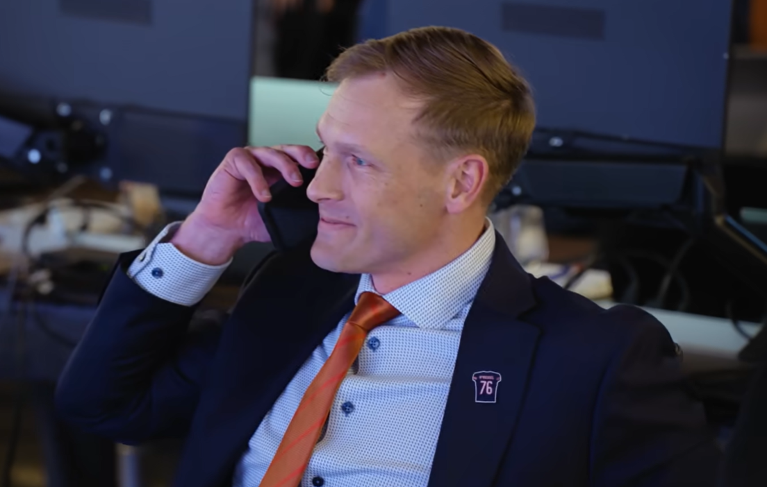 Chicago Bears head coach Ben Johnson on the phone during the 2025 NFL Draft
