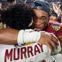 Alabama quarterback Tua Tagovailoa (13) hugs Oklahoma quarterback Kyler Murray (1) following the Orange Bowl at Hard Rock Stadium in Miami Gardens.