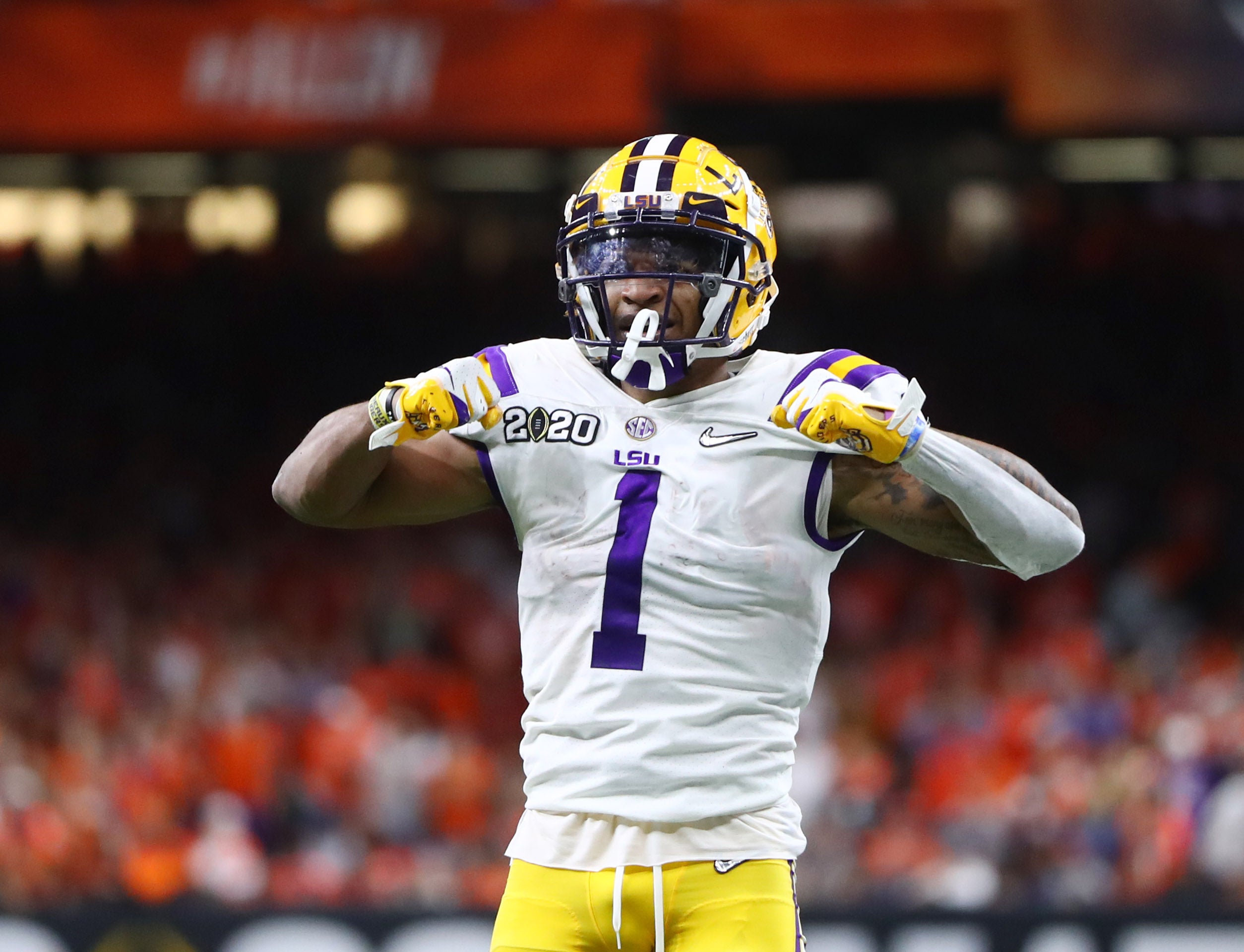 Jan 13, 2020; New Orleans, Louisiana, USA; LSU Tigers wide receiver Ja'Marr Chase (1) reacts against the Clemson Tigers in the third quarter in the College Football Playoff national championship game at Mercedes-Benz Superdome.