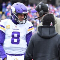 Nov 13, 2022; Orchard Park, New York, USA; Minnesota Vikings quarterback Kirk Cousins (8) gets instrucyion from head coach Kevin O'Connell in the first quarter game against the Buffalo Bills at Highmark Stadium.