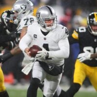 as Vegas Raiders Derek Carr (4) prepares to hand the ball off during the first half against the Pittsburgh Steelers at Acrisure Stadium in Pittsburgh, PA on December 24, 2022. Pittsburgh Steelers Vs Las Vegas Raiders Week 16