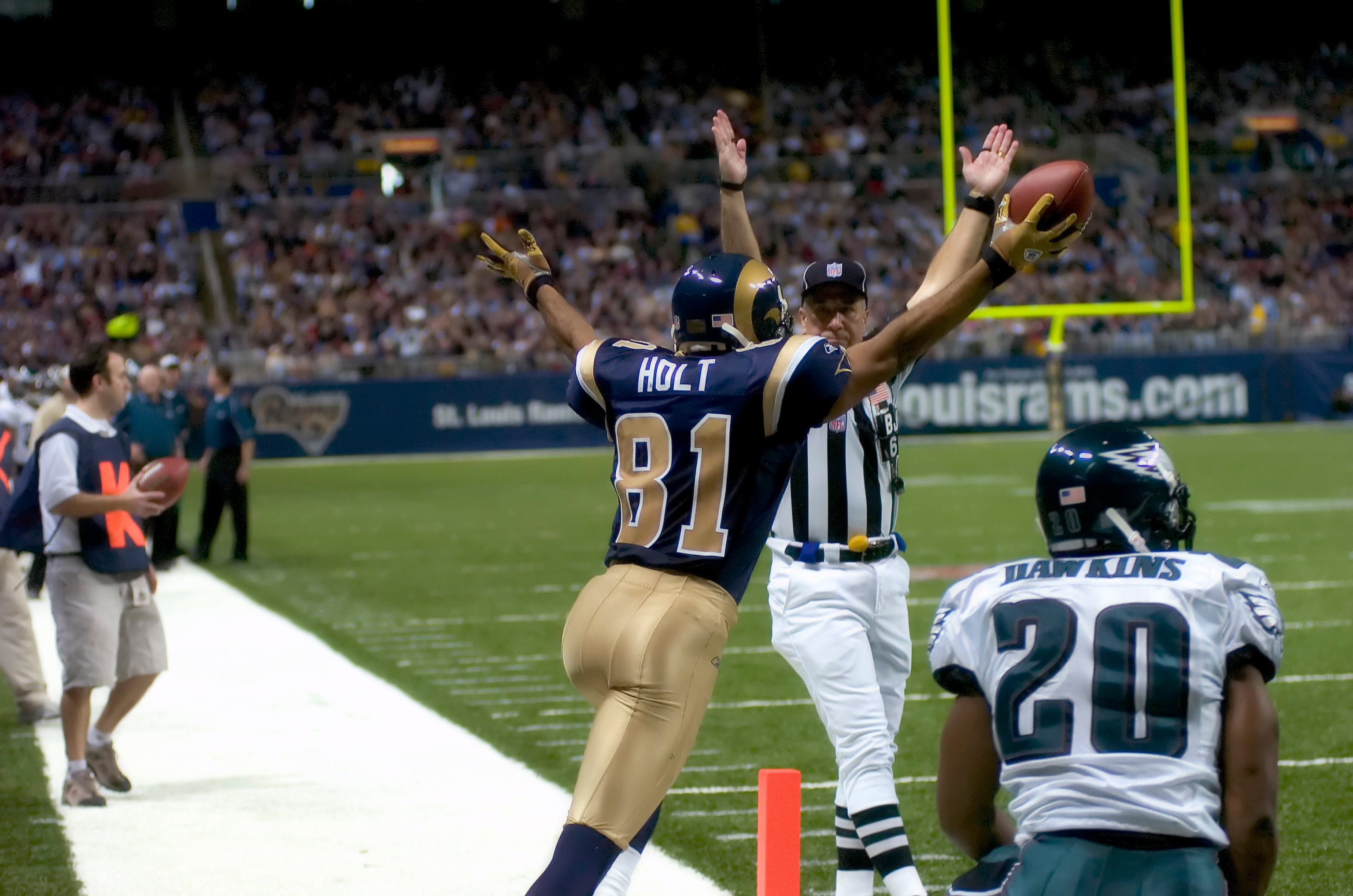 December 18, 2005; St. Louis, MO, USA; St. Louis Rams wide receiver Torry Holt (81) celebrates his touchdown in front of Philadelphia Eagles safety Brian Dawkins (20) at the Edward Jones Dome.