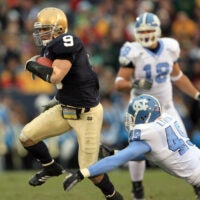Nov. 4, 2006; South Bend, IN, USA; Notre Dame Fighting Irish defensive back (9) Tom Zbikowksi runs a punt back for a second quarter touchdown as North Carolina Tar Heels defender (49) Ryan Taylor attempts to tackle. Mandatory Credit: Matt Cashore-USA TODAY Sports © copyright (2006) Matt Cashore