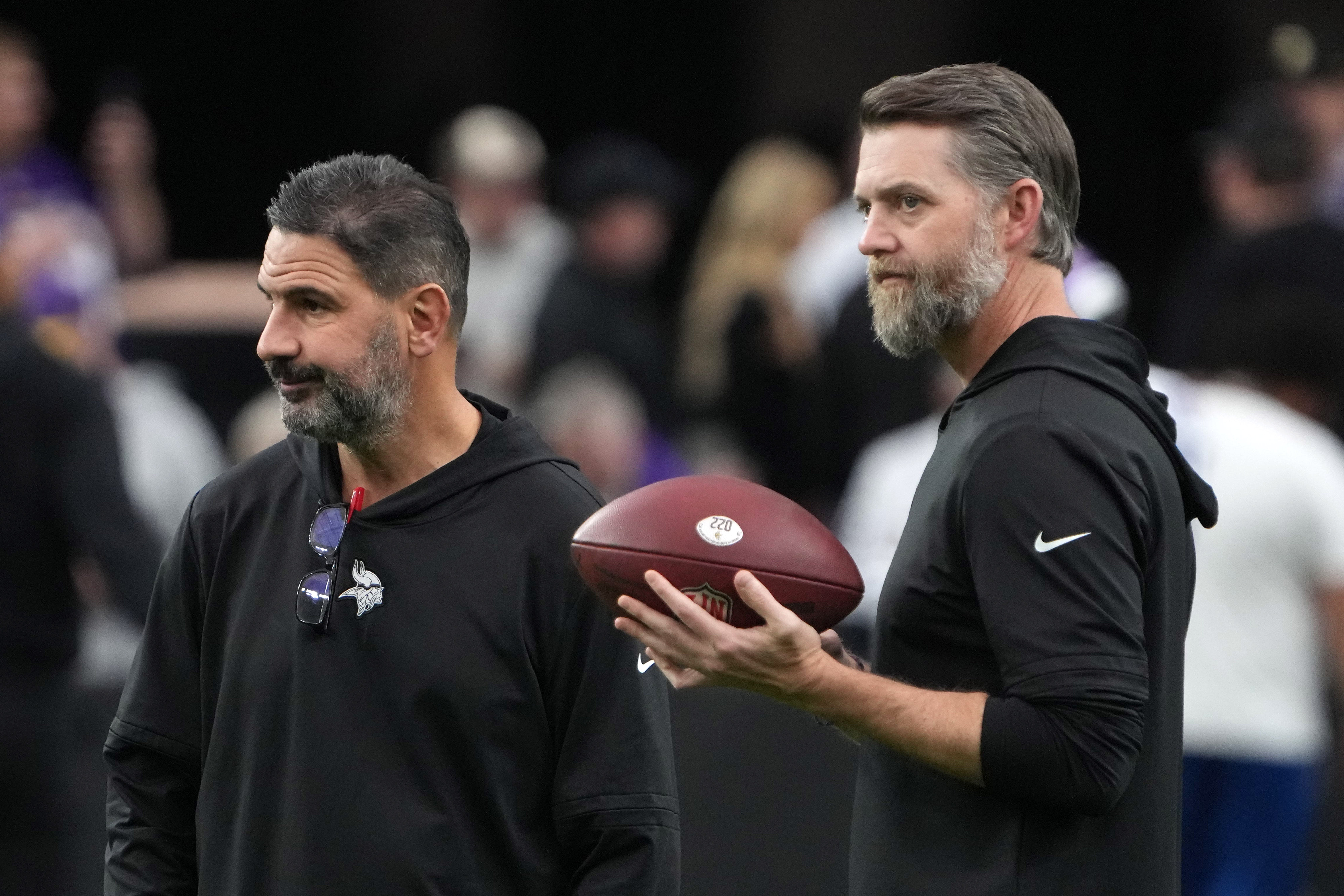 Dec 10, 2023; Paradise, Nevada, USA; Minnesota Vikings tight ends coach Brian Angelichio (left) and offensive coordinator Wes Phillips react during the game against the Las Vegas Raiders at Allegiant Stadium.