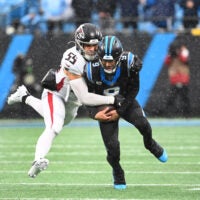 Dec 17, 2023; Charlotte, North Carolina, USA; Carolina Panthers quarterback Bryce Young (9) is tackled by Atlanta Falcons linebacker Kaden Elliss (55) in the third quarter at Bank of America Stadium.