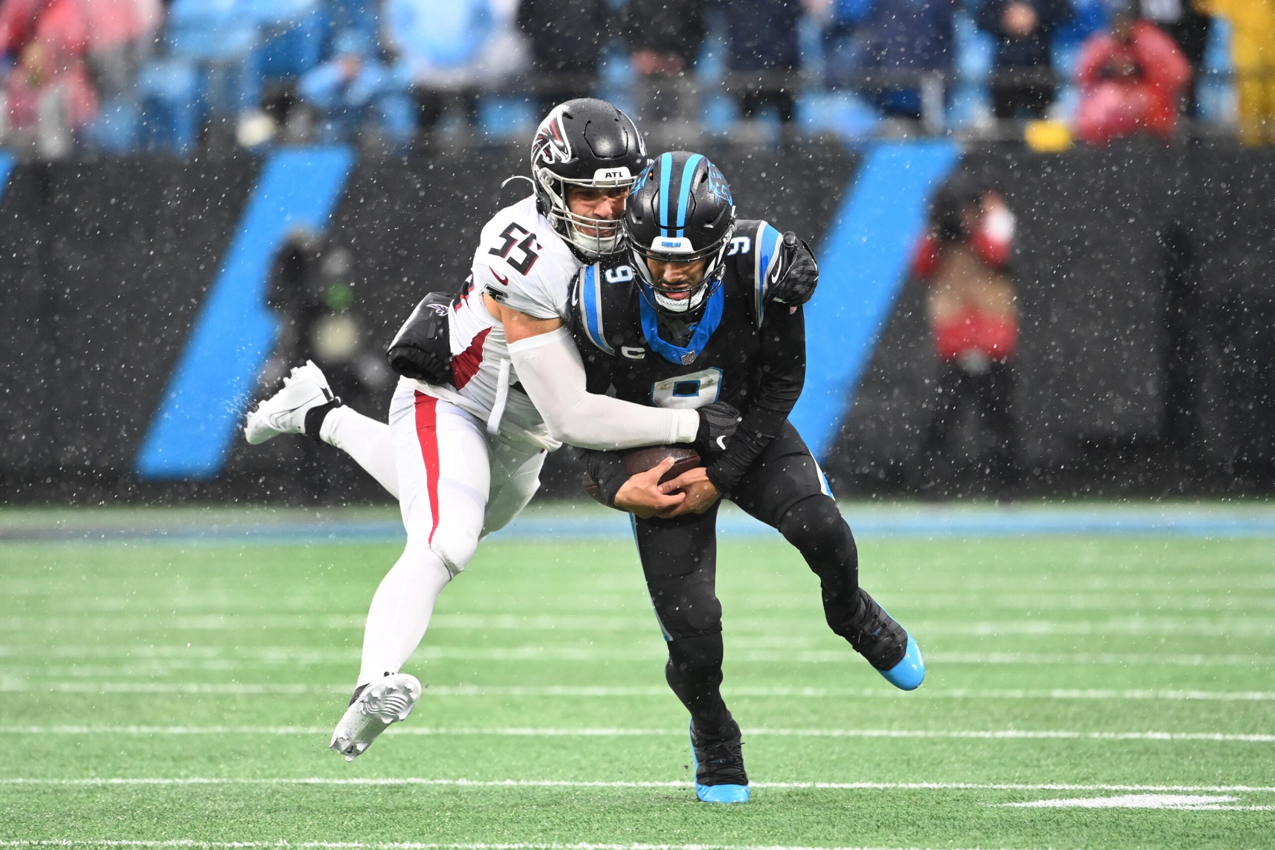 Dec 17, 2023; Charlotte, North Carolina, USA; Carolina Panthers quarterback Bryce Young (9) is tackled by Atlanta Falcons linebacker Kaden Elliss (55) in the third quarter at Bank of America Stadium.