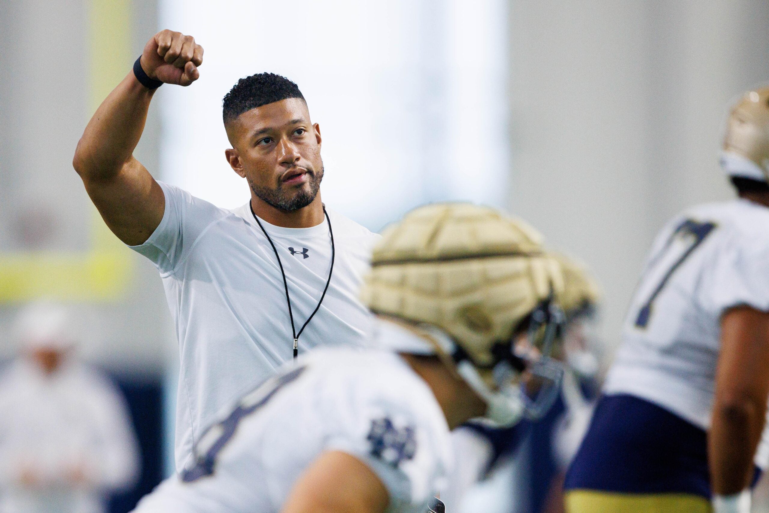 Notre Dame head coach Marcus Freeman warms up during a Notre Dame football practice at Irish Athletic Center on Thursday, Aug. 15, 2024, in South Bend.