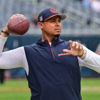 Aug 17, 2024; Chicago, Illinois, USA; Chicago Bears general manager Ryan Poles plays catch on the sideline before the game against the Cincinnati Bengals at Soldier Field.