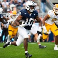 Penn State running back Nick Singleton (10) carries the ball in the second half of an NCAA football game against Kent State, Saturday, Sept. 21, 2024, in State College, Pa.
