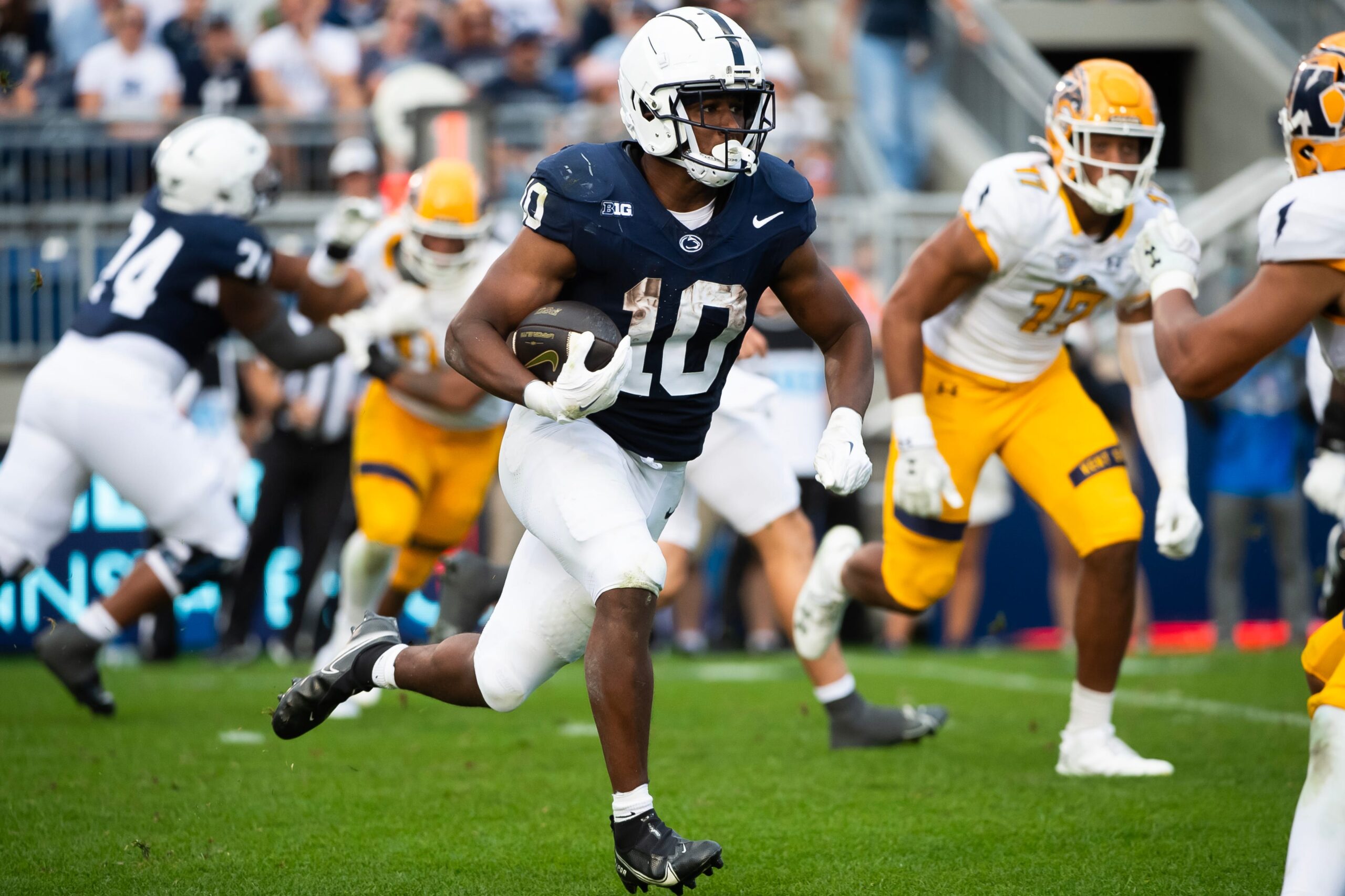 Penn State running back Nick Singleton (10) carries the ball in the second half of an NCAA football game against Kent State, Saturday, Sept. 21, 2024, in State College, Pa.