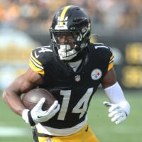 Nov 17, 2024; Pittsburgh, Pennsylvania, USA; Pittsburgh Steelers wide receiver George Pickens (14) runs after a catch against the Baltimore Ravens during the first quarter at Acrisure Stadium.