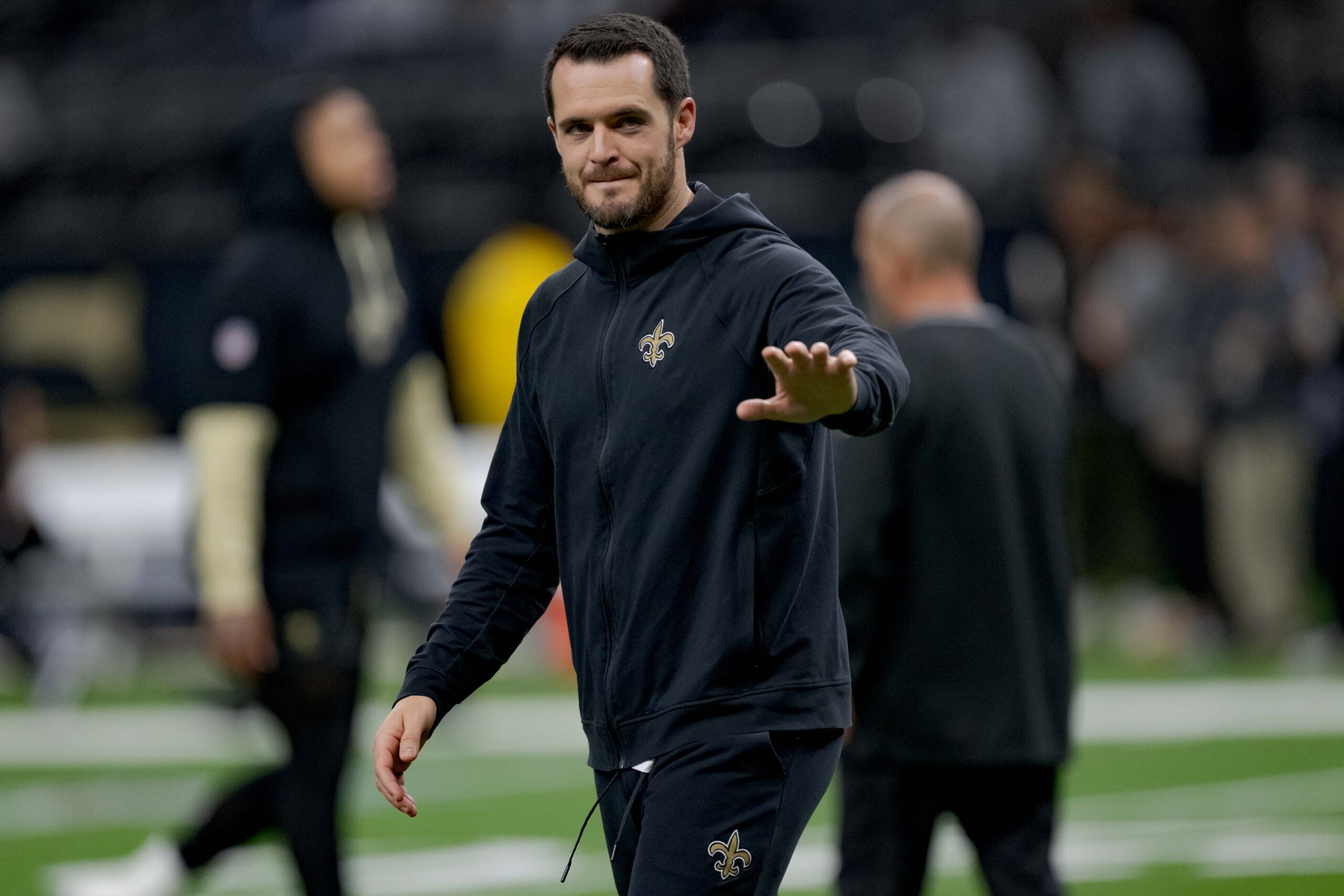 Dec 29, 2024; New Orleans, Louisiana, USA; New Orleans Saints quarterback Derek Carr (4) walks the field before a game against the Las Vegas Raiders at Caesars Superdome.