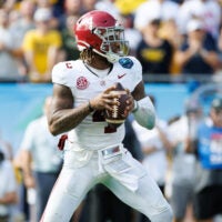 Dec 31, 2024; Tampa, FL, USA; Alabama Crimson Tide quarterback Jalen Milroe (4) looks to throw against the Michigan Wolverines during the second half at Raymond James Stadium.