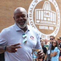 Aug 2, 2025; Canton, OH, USA; Hall of Fame member Emmitt Smith enters the ceremonies at the Pro Football Hall of Fame-Class of 2025 enshrinement ceremonies at Tom Benson Hall of Fame Stadium.