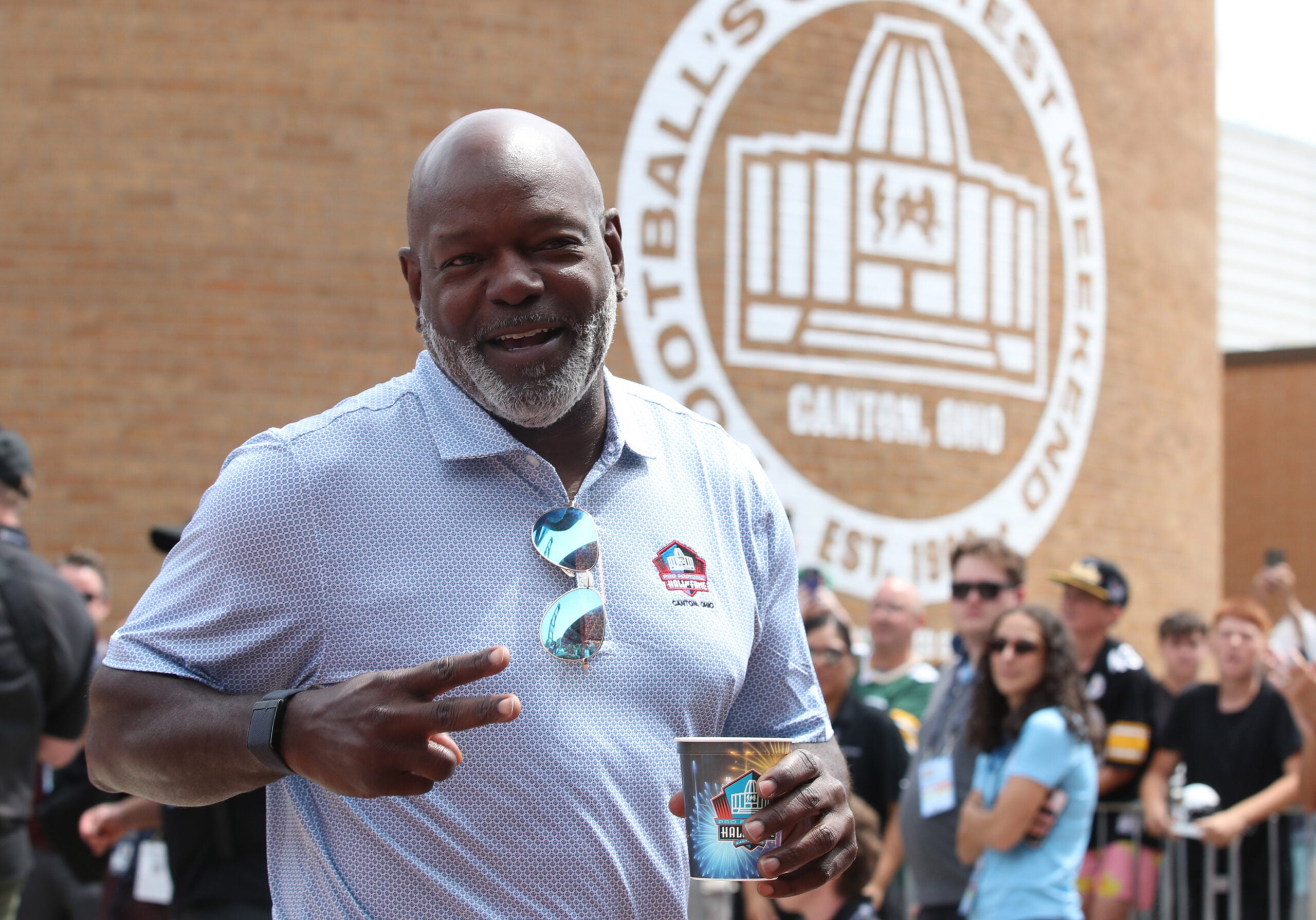 Aug 2, 2025; Canton, OH, USA; Hall of Fame member Emmitt Smith enters the ceremonies at the Pro Football Hall of Fame-Class of 2025 enshrinement ceremonies at Tom Benson Hall of Fame Stadium.