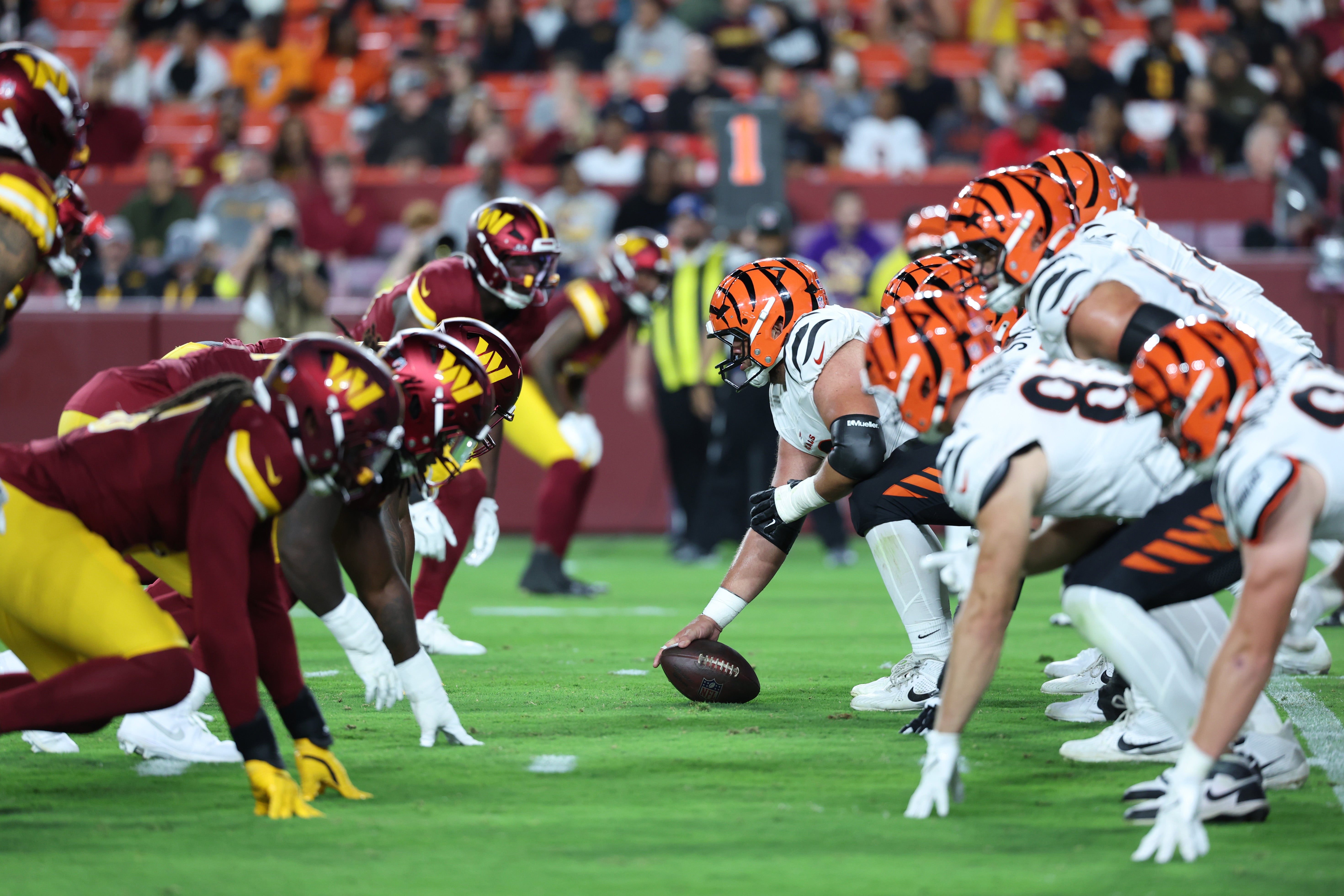Aug 18, 2025; Landover, Maryland, USA; The Cincinnati Bengals line up for a snap against the Washington Commanders during the second half at Northwest Stadium.