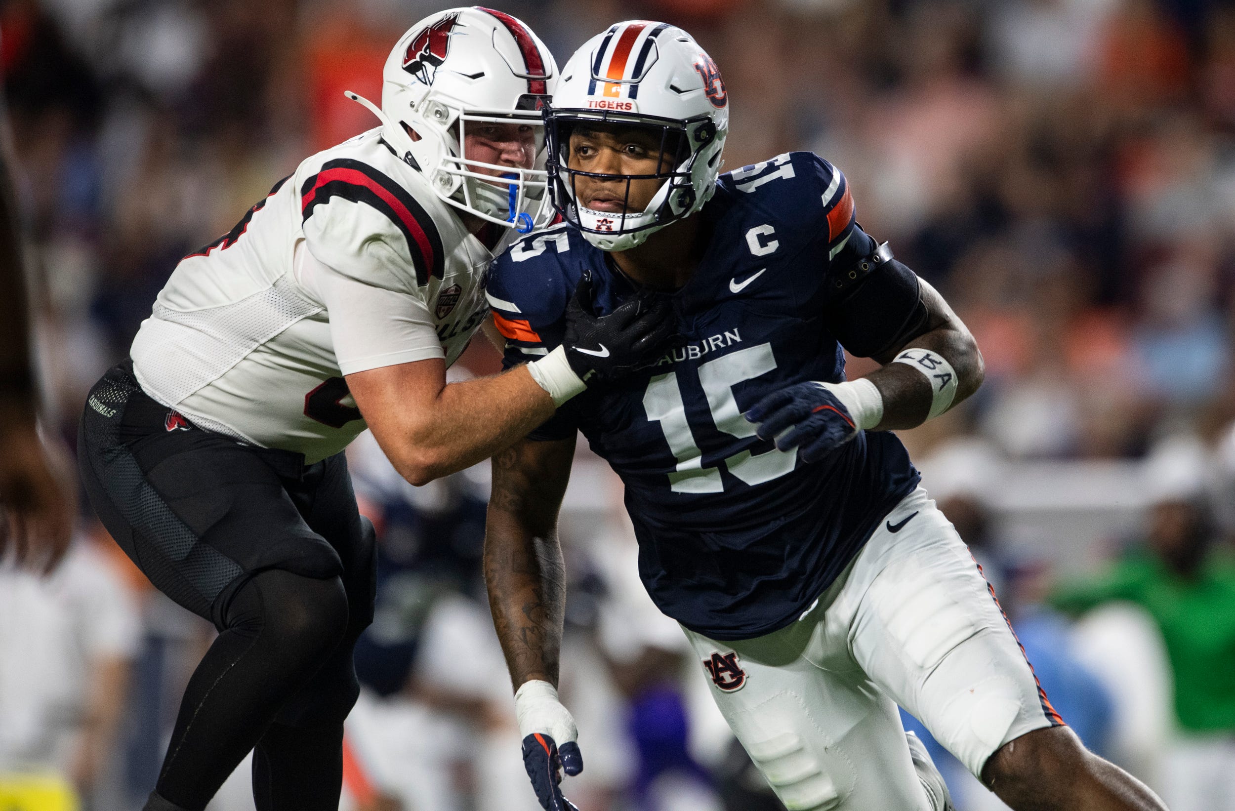 Auburn Tigers defensive end Keldric Faulk (15) blitzes as Auburn Tigers take on Ball State Cardinals at Jordan-Hare Stadium in Auburn, Ala. on Saturday, Sept. 6, 2025. Auburn Tigers defeated Ball State Cardinals 42-3.