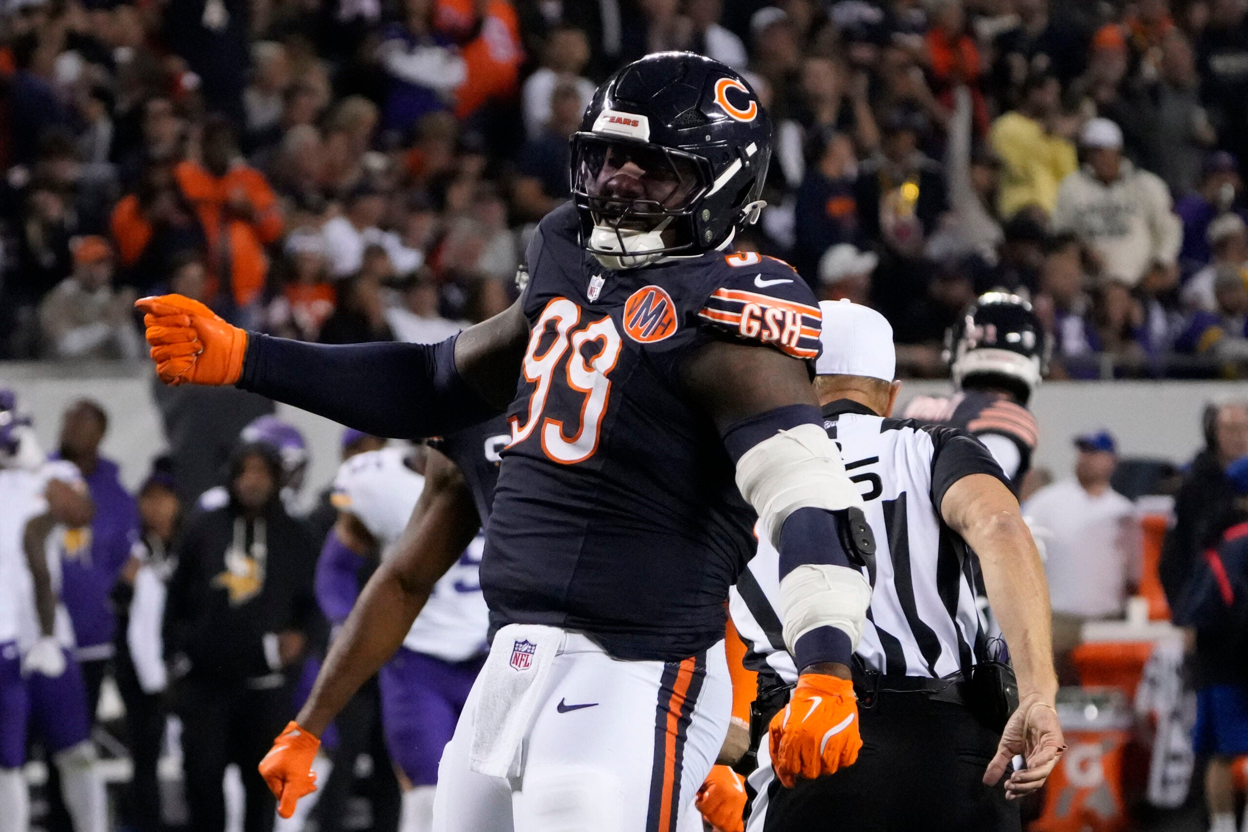 Sep 8, 2025; Chicago, Illinois, USA; Chicago Bears defensive tackle Gervon Dexter Sr. (99) reacts after a sack against the Minnesota Vikings during the second half at Soldier Field.