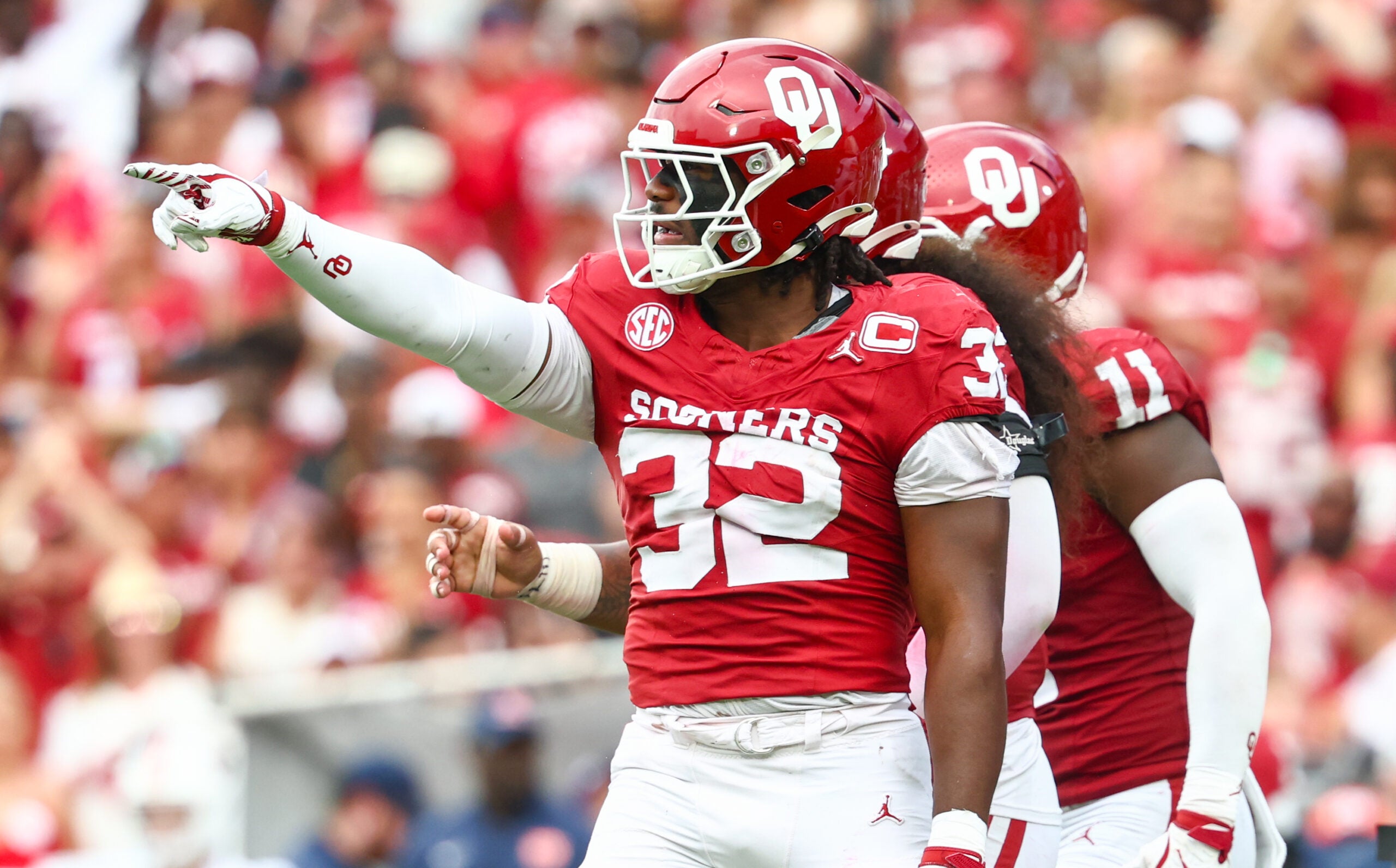 Sep 20, 2025; Norman, Oklahoma, USA; Oklahoma Sooners defensive lineman R Mason Thomas (32) reacts after recording a sack during the third quarter against the Auburn Tigers at Gaylord Family-Oklahoma Memorial Stadium.