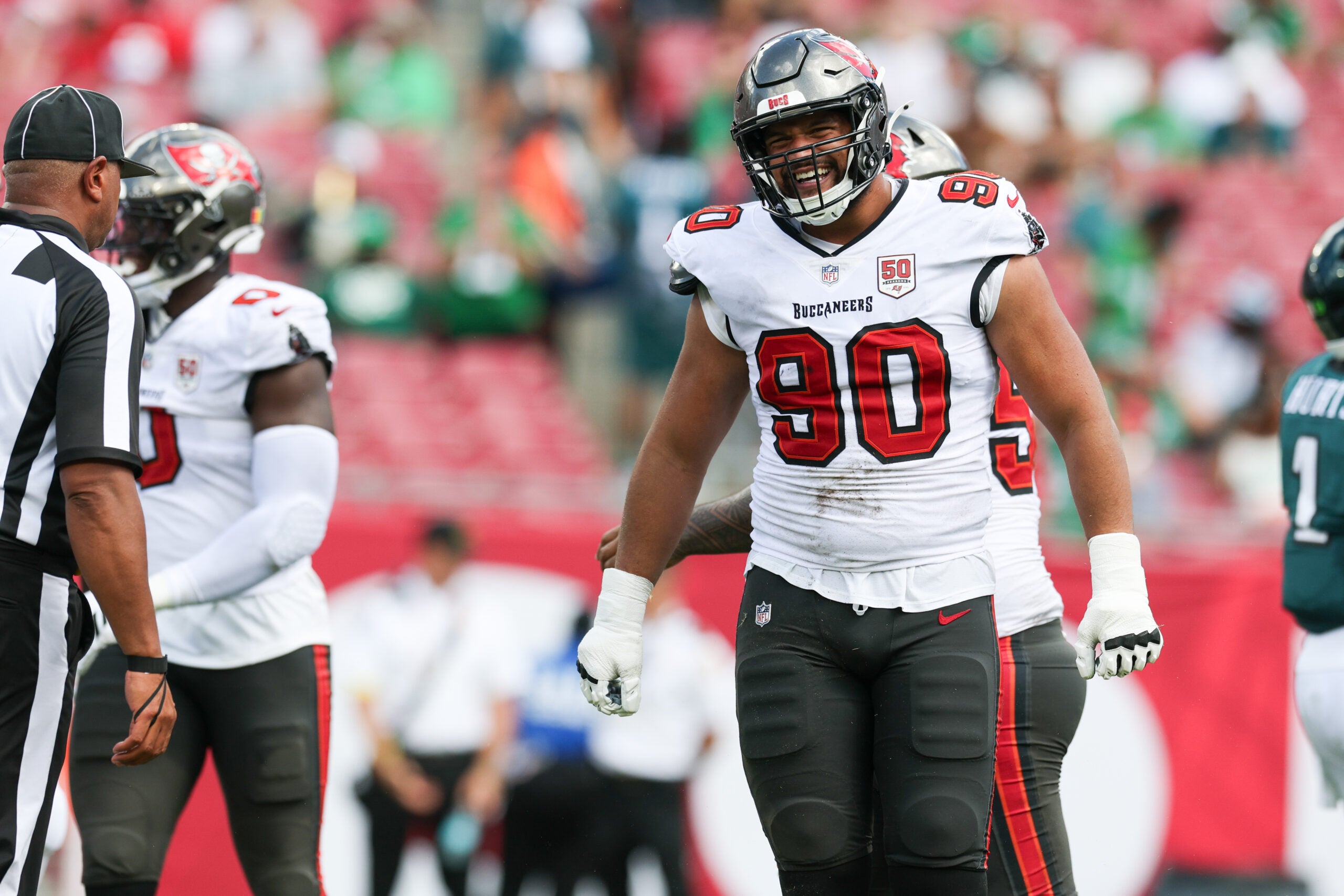 Sep 28, 2025; Tampa, Florida, USA; Tampa Bay Buccaneers defensive end Logan Hall (90) reacts after a play during the third quarter against the Philadelphia Eagles at Raymond James Stadium.