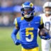 Sep 28, 2025; Inglewood, California, USA; Los Angeles Rams wide receiver Tutu Atwell (5) runs for a touchdown on an 88 yard pass play in the fourth quarter against the Indianapolis Colts at SoFi Stadium.