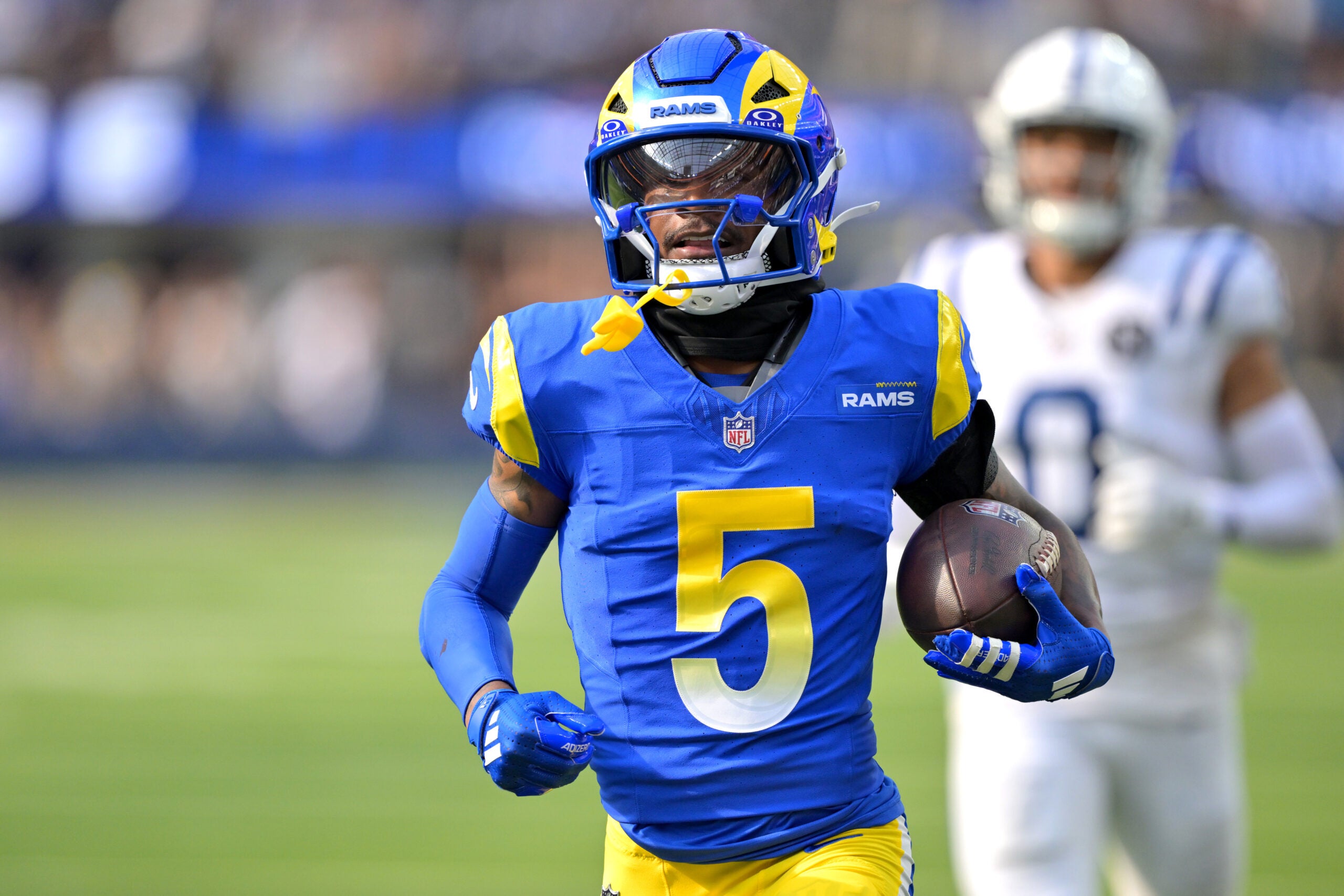 Sep 28, 2025; Inglewood, California, USA; Los Angeles Rams wide receiver Tutu Atwell (5) runs for a touchdown on an 88 yard pass play in the fourth quarter against the Indianapolis Colts at SoFi Stadium.
