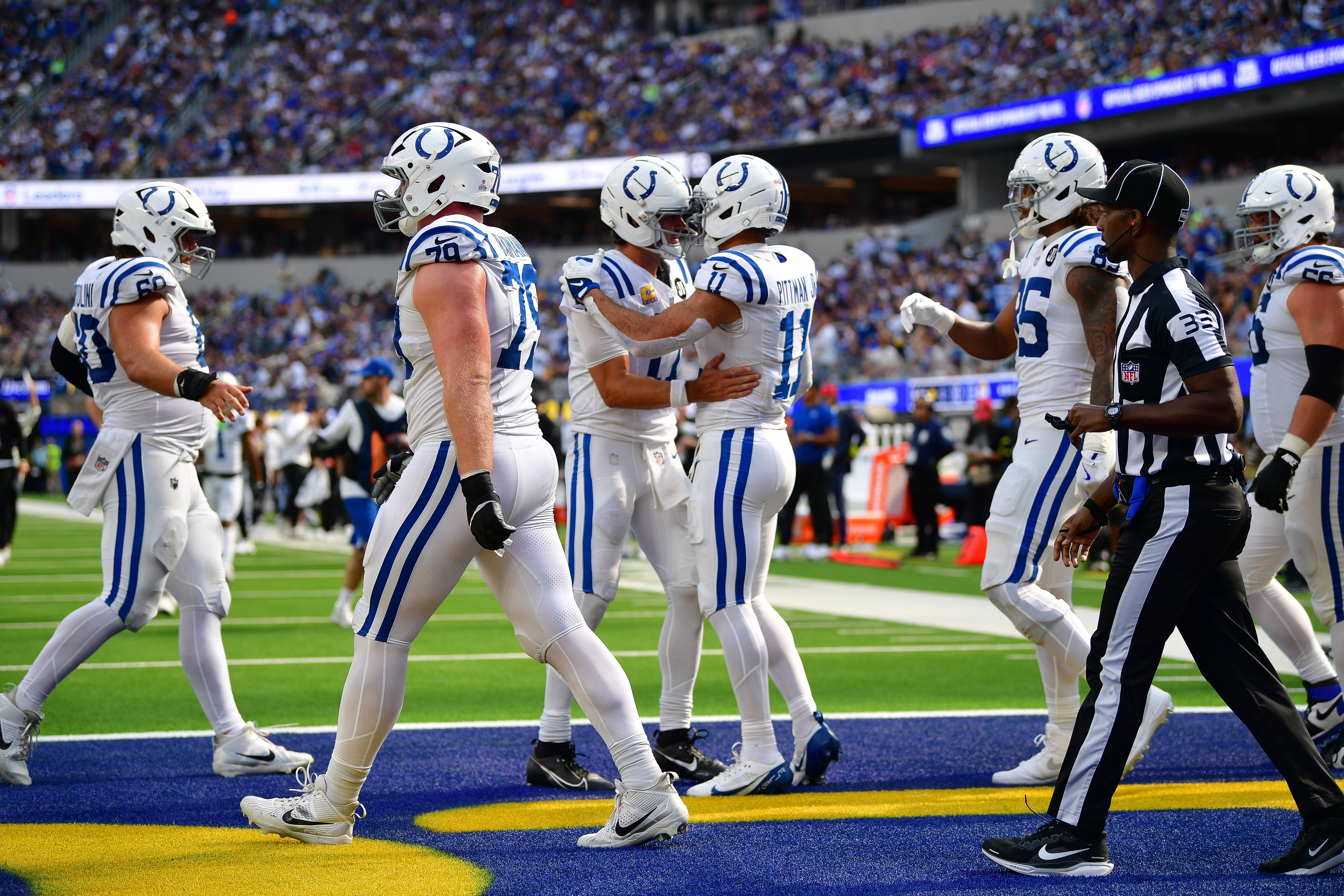 Colts quarterback Daniel Jones and wide receiver Michael Pittman Jr. celebrate a touchdown