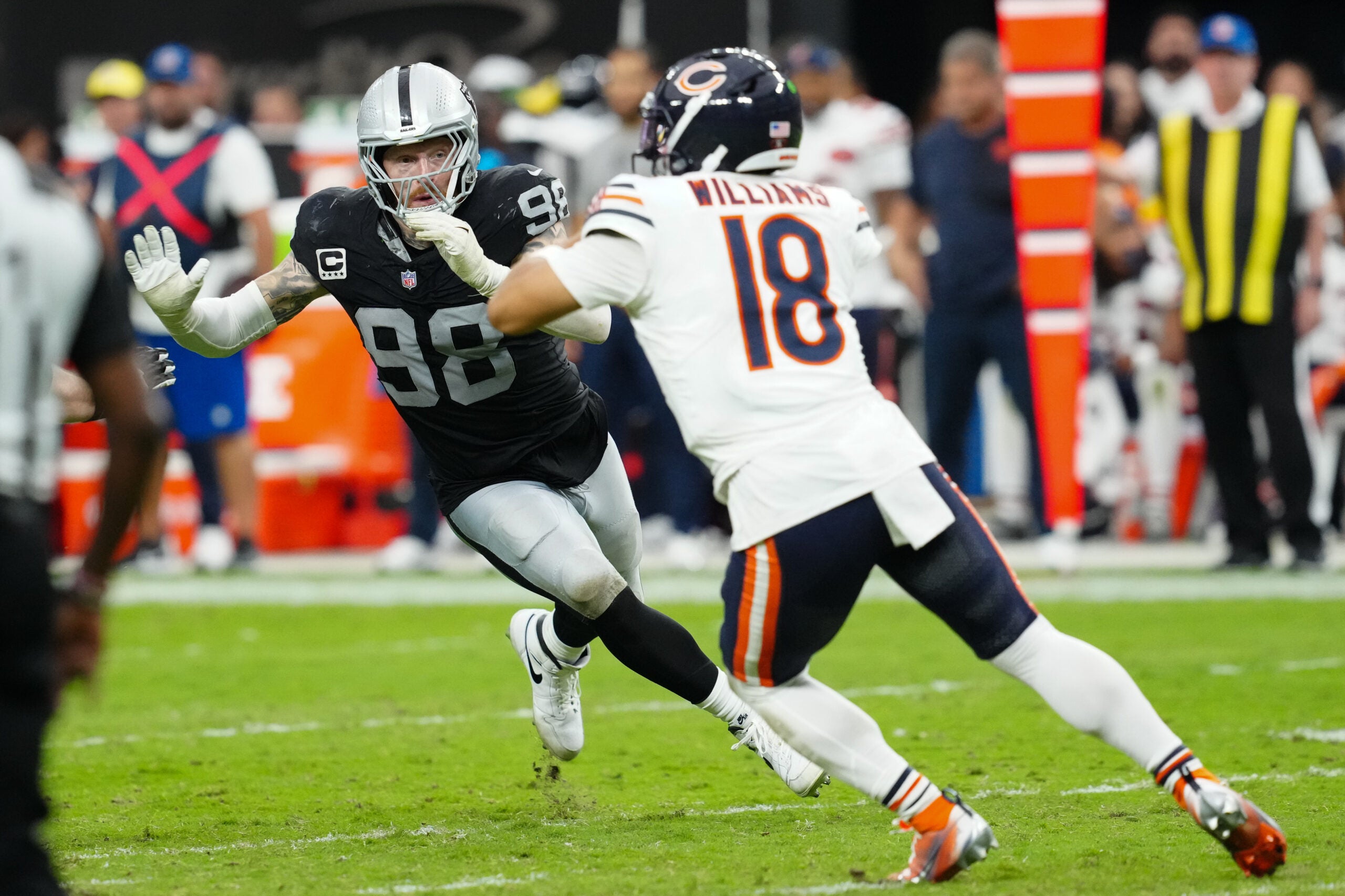 Sep 28, 2025; Paradise, Nevada, USA; Las Vegas Raiders defensive end Maxx Crosby (98) pressures Chicago Bears quarterback Caleb Williams (18) during the second half at Allegiant Stadium.